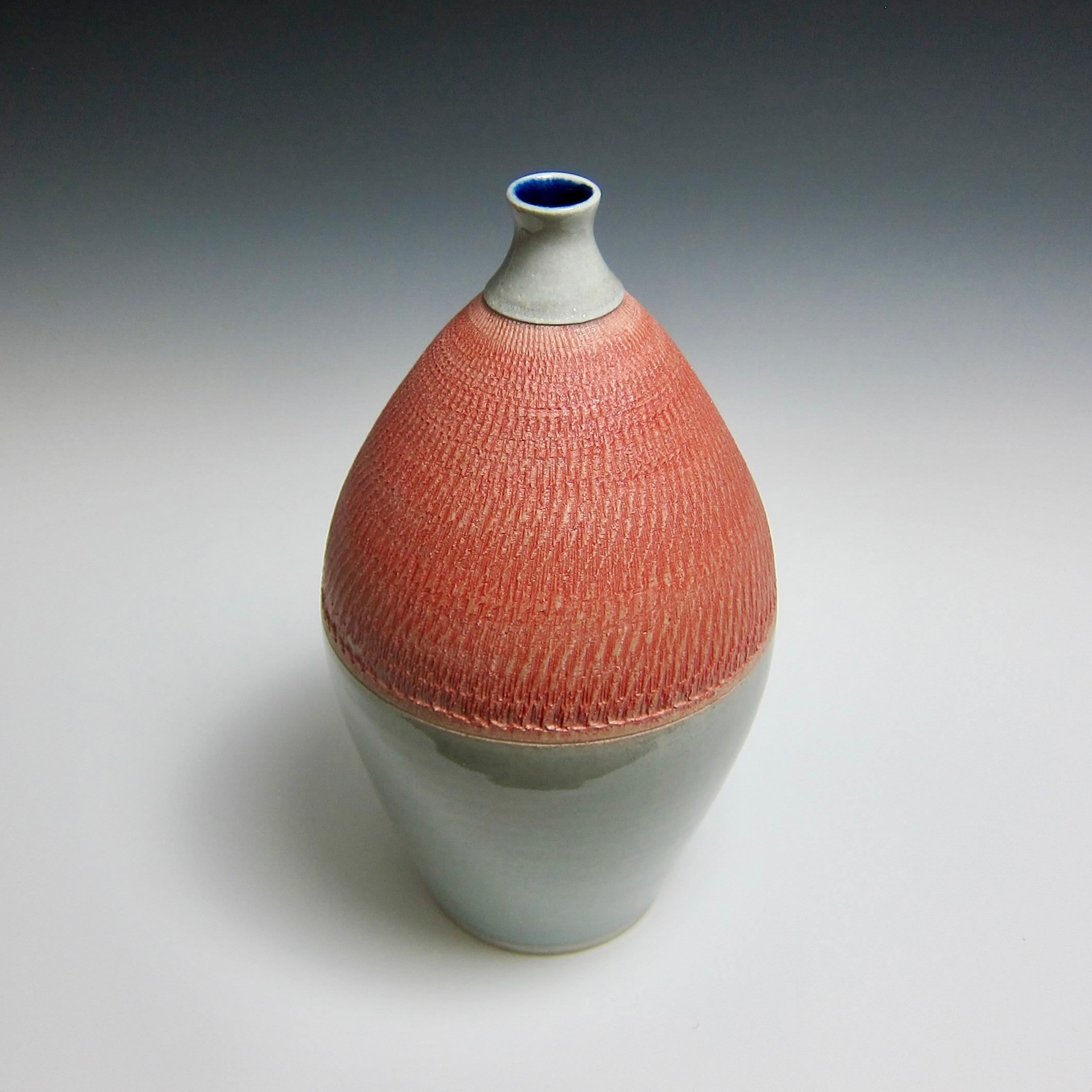 Wheel Thrown Bottle With Chattering by Jason Fox.

A Southern Californian for over half his life, Contemporary Ceramic Artist Jason Fox draws upon his classical education in Architecture and Art History as well as his love of surfing and the ocean.