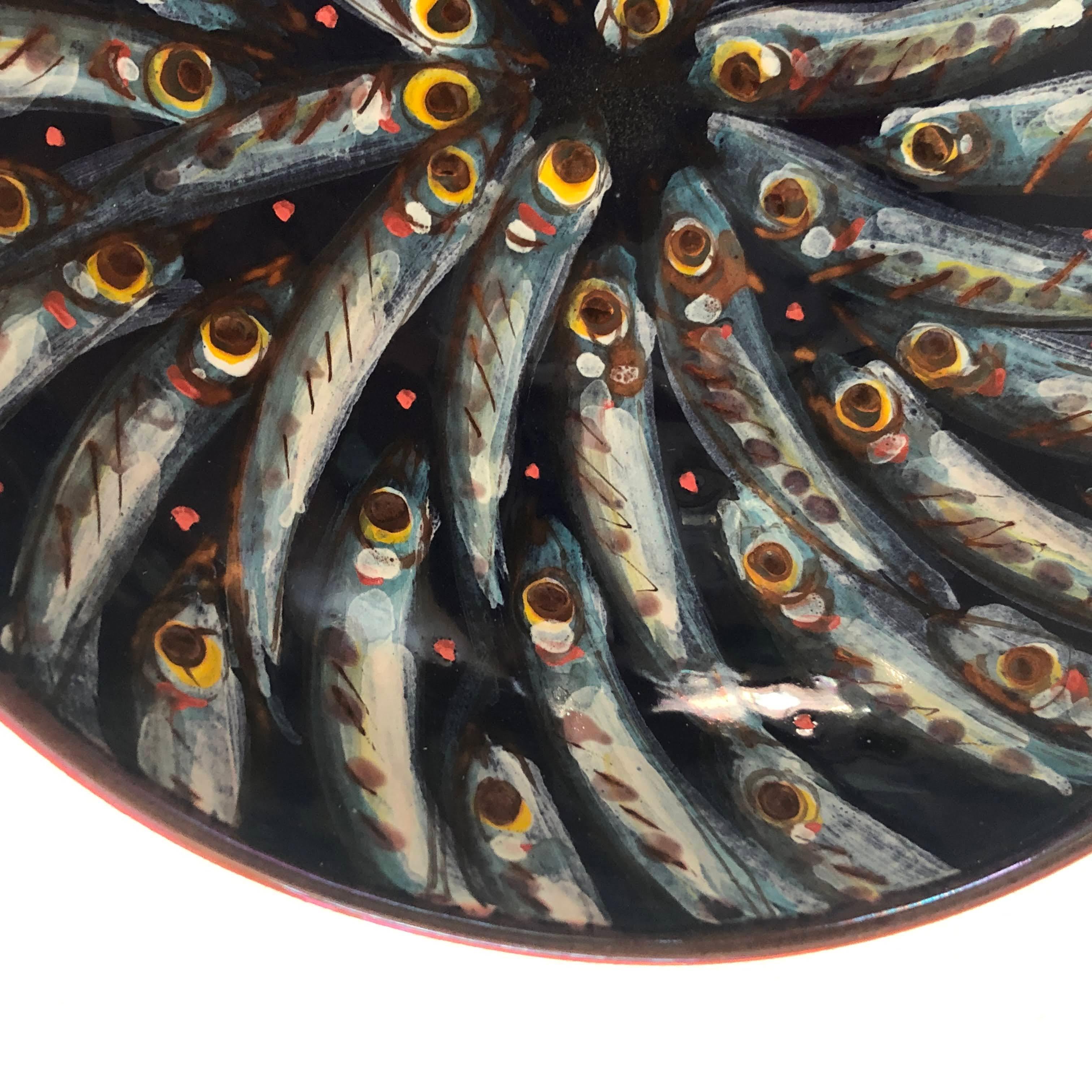 Ceramic bowl with Sardines decor, full-fire reduction faience earthenware 20 cm diameter, hand painted unique piece, 2017.
Perfect decor for the wall or simply placed on a coffee table, these stunning designs will have a treasured place in your