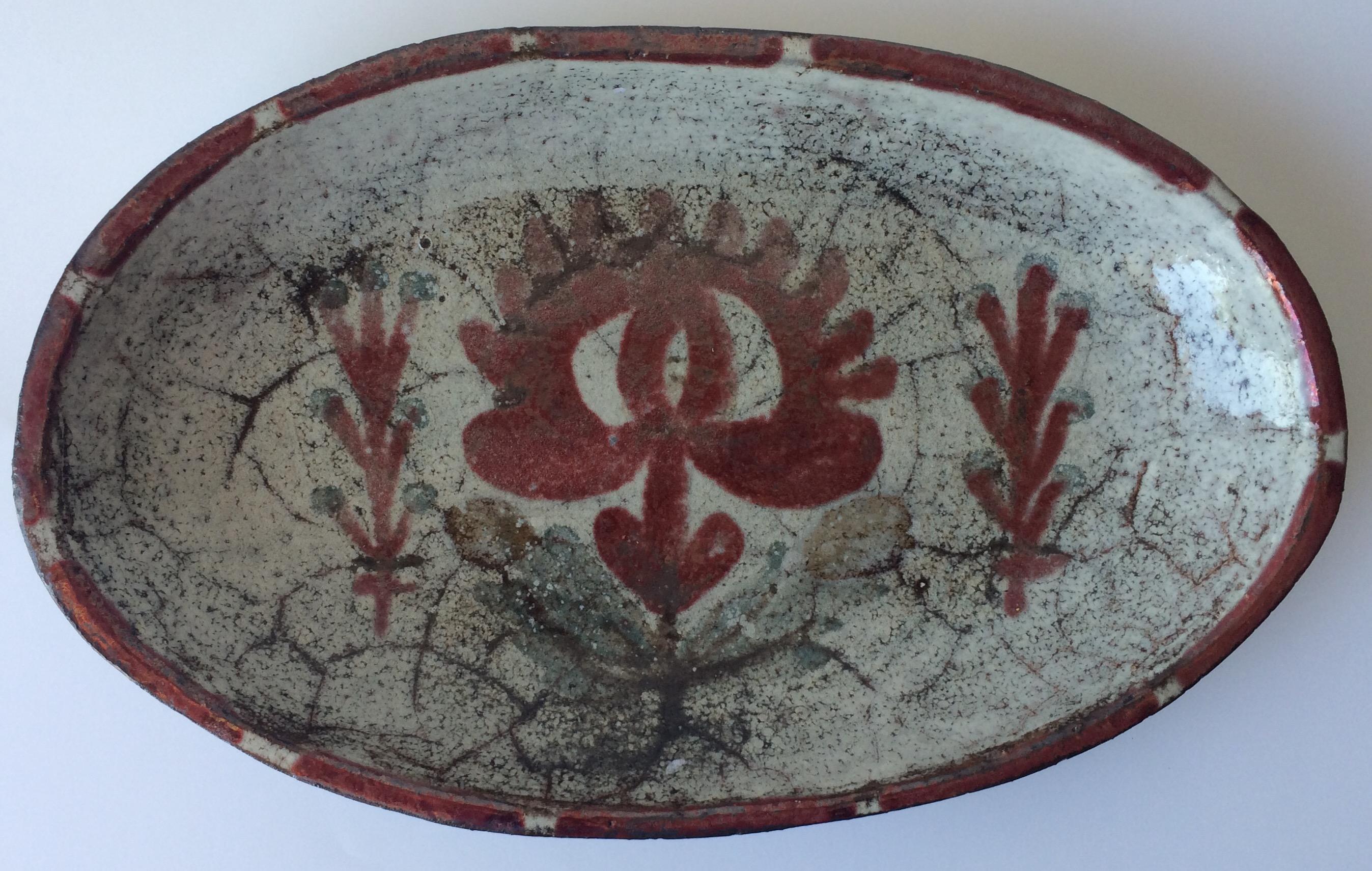 Beautiful midcentury handcrafted bowl by Gustave Reynaud for Atelier Le Murier.
Earthenware decorated with scarifications on gray enamel and red copper.
Wood firing.
Hand written signature under the base.
Wonderful form. 

Gustave Reynaud was Jean
