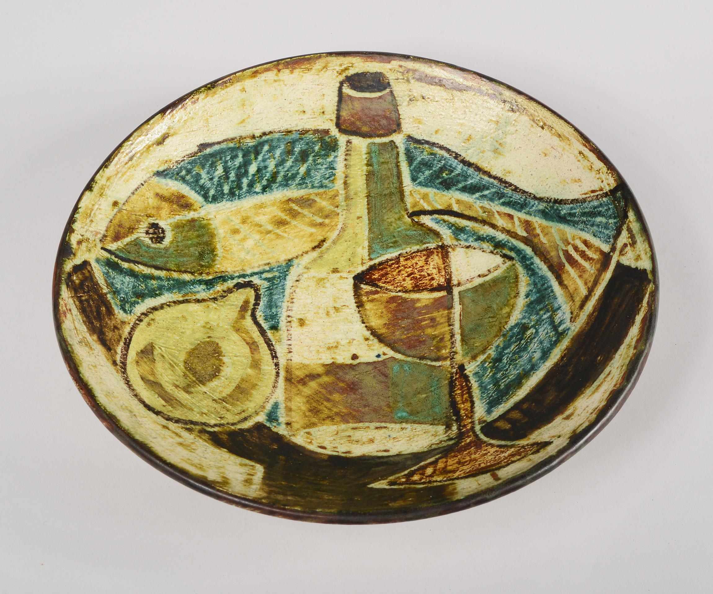 Ceramic bowl by Danish artist Preben Herluf Gottschalk-Olsen, (1915-1968). The cubist still life in the interior of this bowl has a very painterly feel to it. There is texture and brushstrokes to the glaze. The bowl is signed GO and retains the