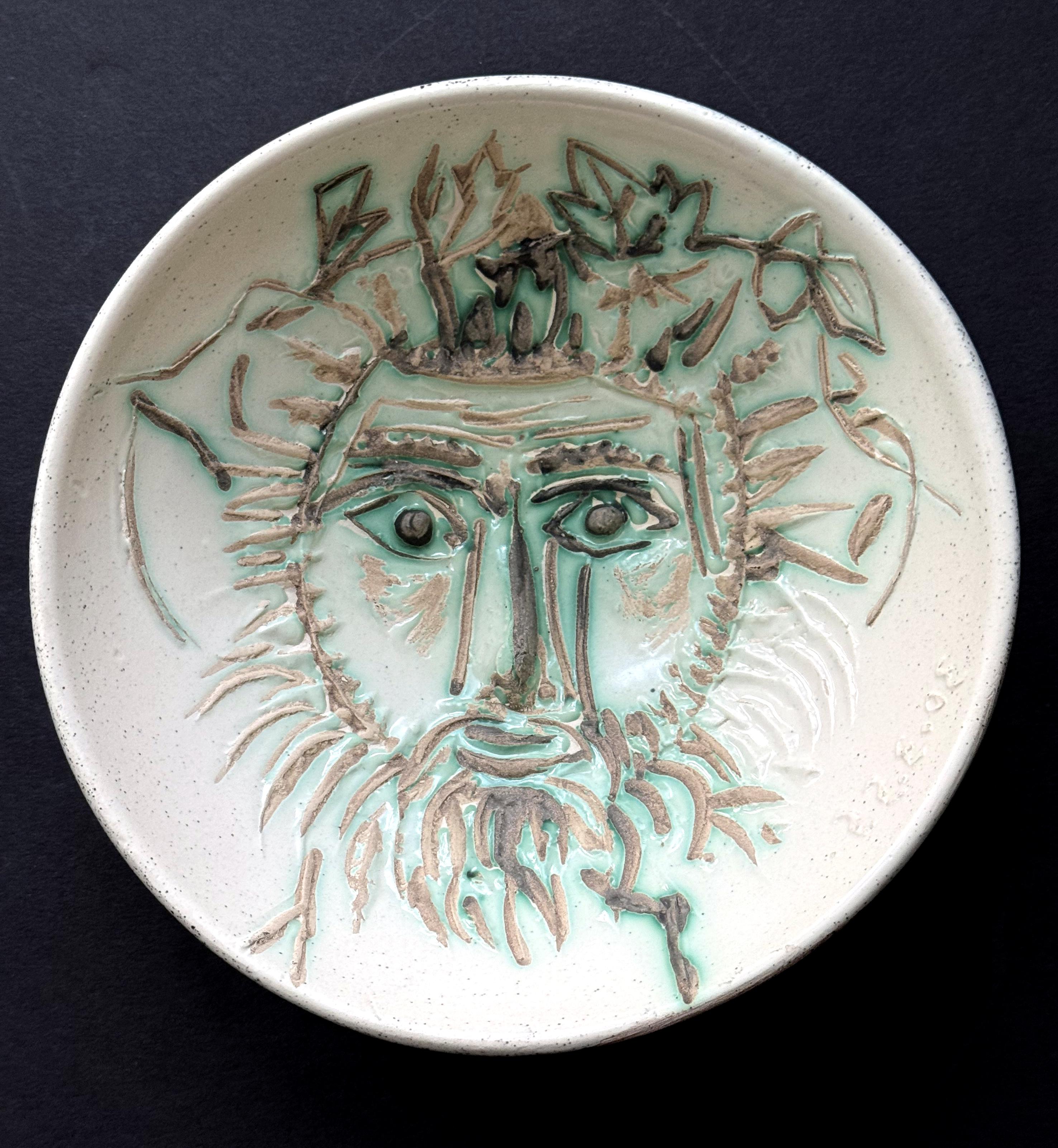 On offer is a ceramic bowl entitled Visage de Faune (A.R.256) by Pablo Picasso (1881-1973). The interior surface of the bowl features a striking rendition of the bespoken drawing the Faun's face by the artist. The visage was outlined with bold