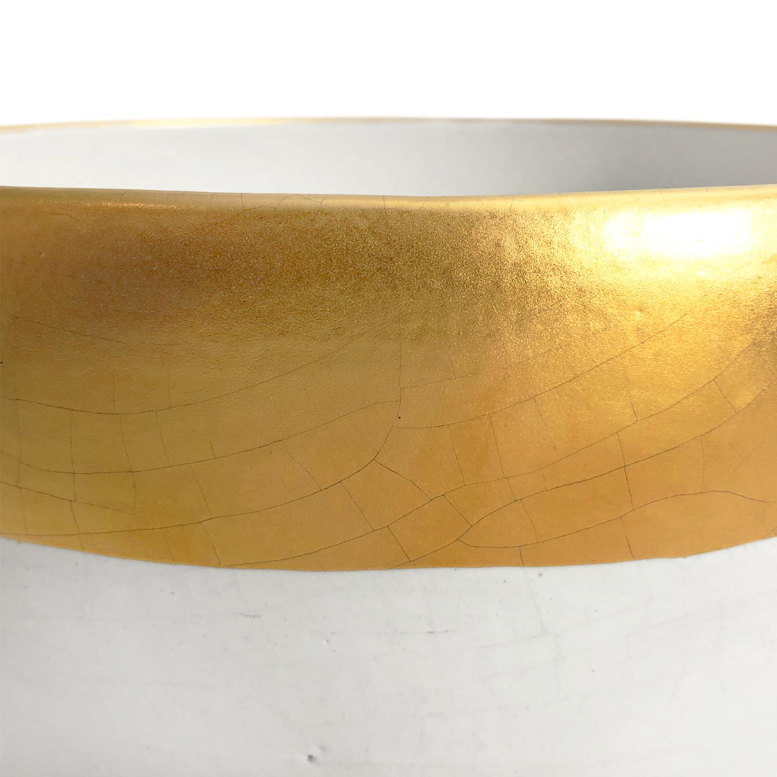 Large curved ceramic bowl with white crackle glaze and 22k matte gold band by Sandi Fellman, 2019.

Veteran photographer Sandi Fellman's ceramic vessels are an exploration of a new medium. The forms, palettes, and sensuality of her photos can be