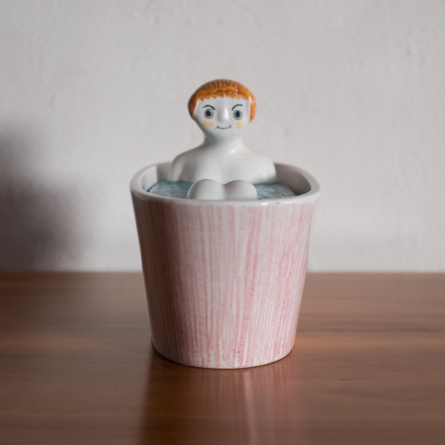 Lidded ceramic box by Giancarlo Tunsi Girard from the 1960s. Includes a label from the high-end department store, I. Magnin. 

Tunsi Girard was the brother of Alexander Girard. Tunsi and Alexander grew up in Italy, where Tunsi lived and worked.