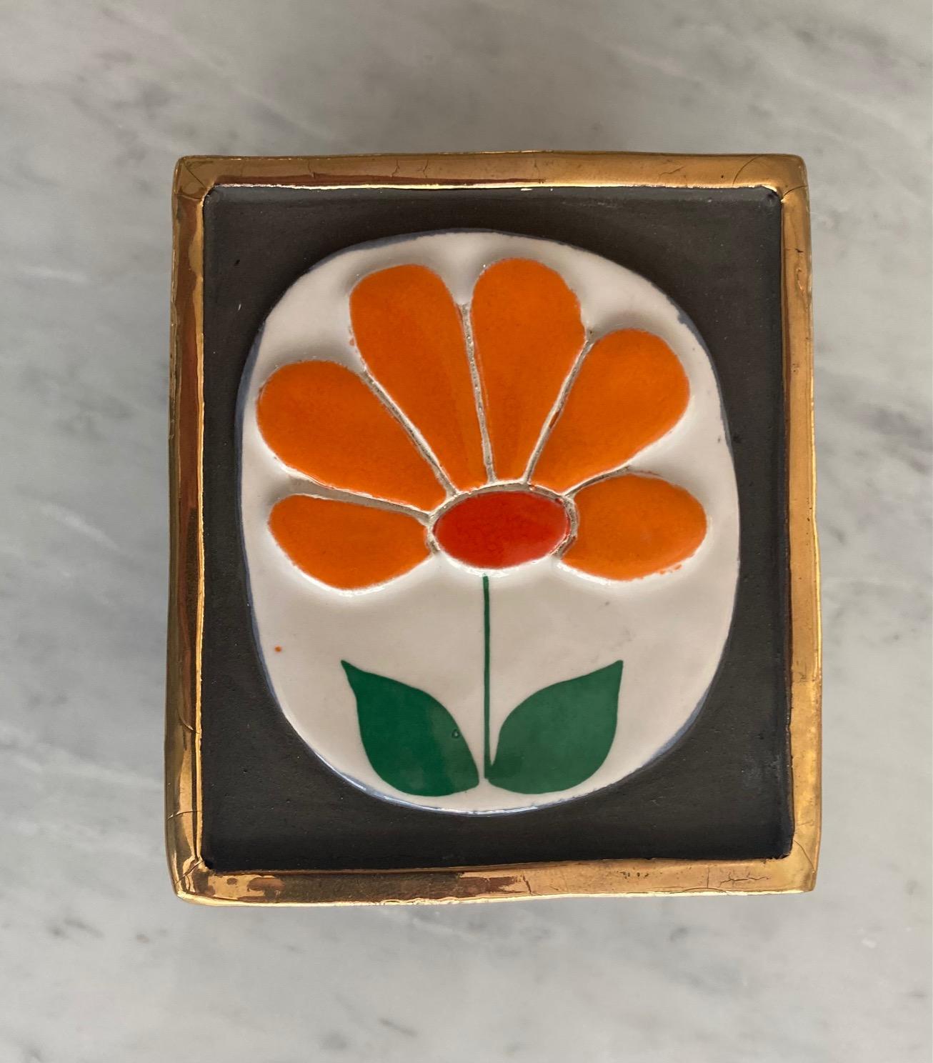 Box by Mithé Espelt; wooden base and ceramic top with flower motive and gilded edges.

Original green felt at the back of the box and of the top.

France circa 1970

This poetic work of art demonstrates Mithé Espelt's talent for design and her