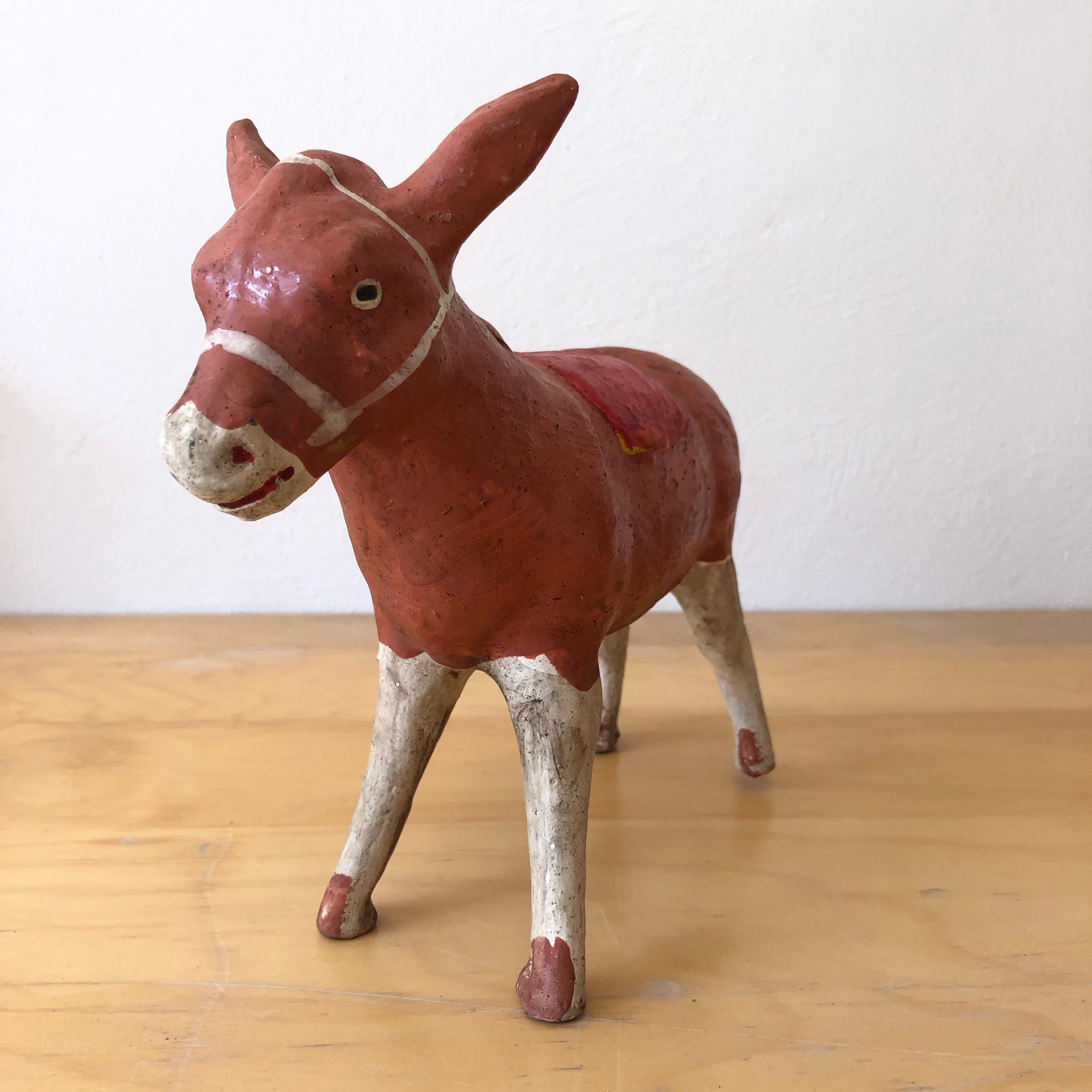 Terracotta colored burro piggy bank from the border area of the state of Mexico with Guerrero. Classic Folk Art ceramic pieces that are hard to come by given their fragile nature, circa 1980s.