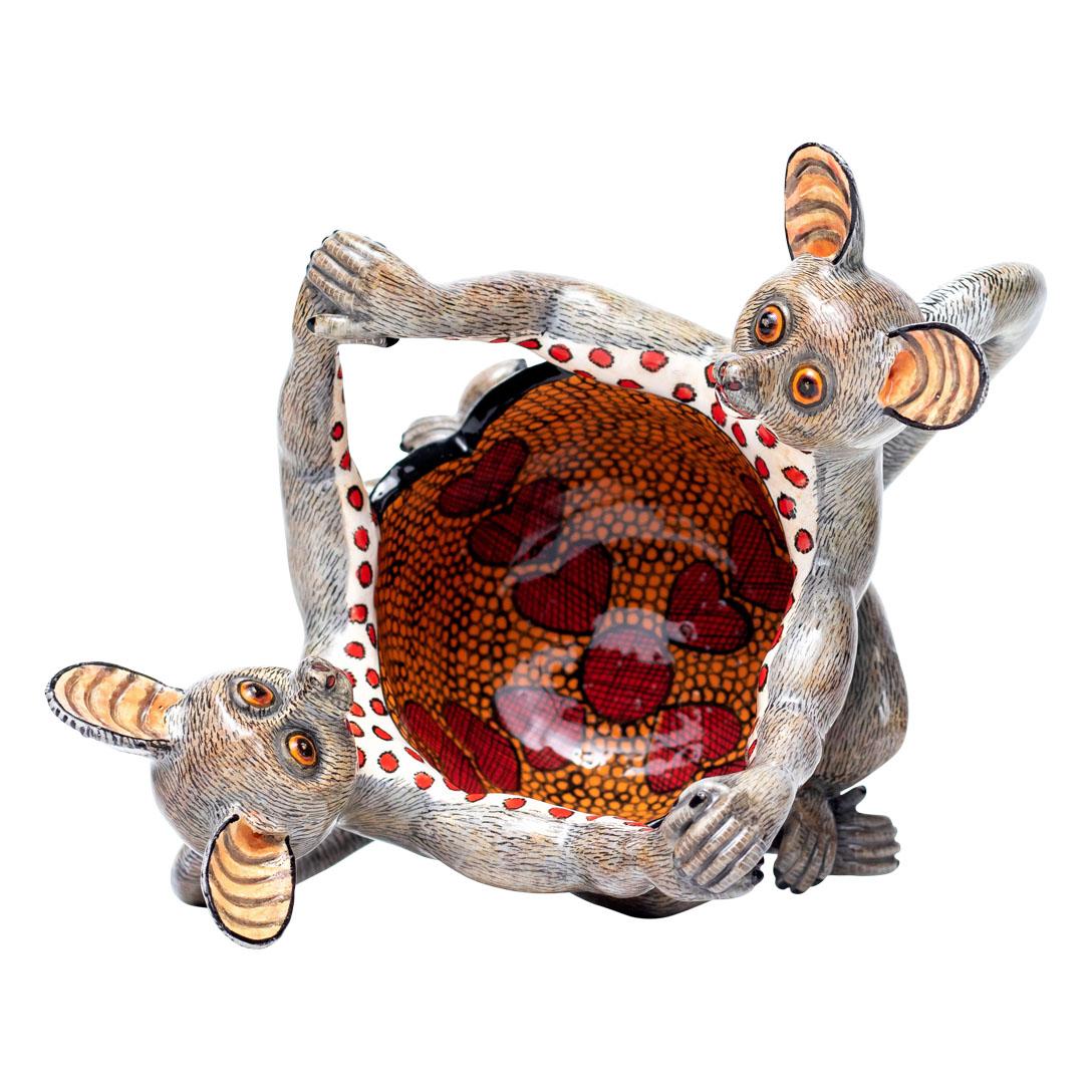 Bushbaby Peanut Bowl
Hand Painted by Jabu Nene, Sculpted by Sfiso Mvelase
Love Art Ceramic, South Africa

The Bushbaby Peanut Bowl is a delightful work of art that celebrates the enchanting wildlife of South Africa. Standing at 6 inches high, and