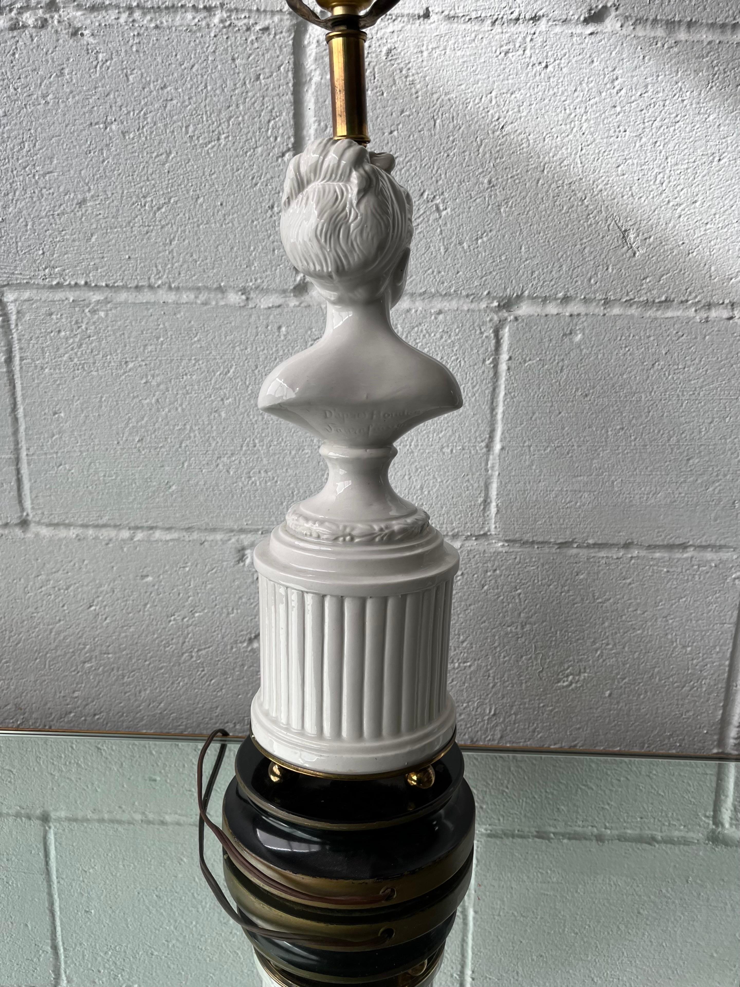 Beautiful Houdon Bust lamp. Such beauty in the subject, nicely finished in high glass glaze. Sits atop a beautiful fluted column topped with laurel wreath and balled base plinth. Signed.
33.5 inches to top of finial as pictured.