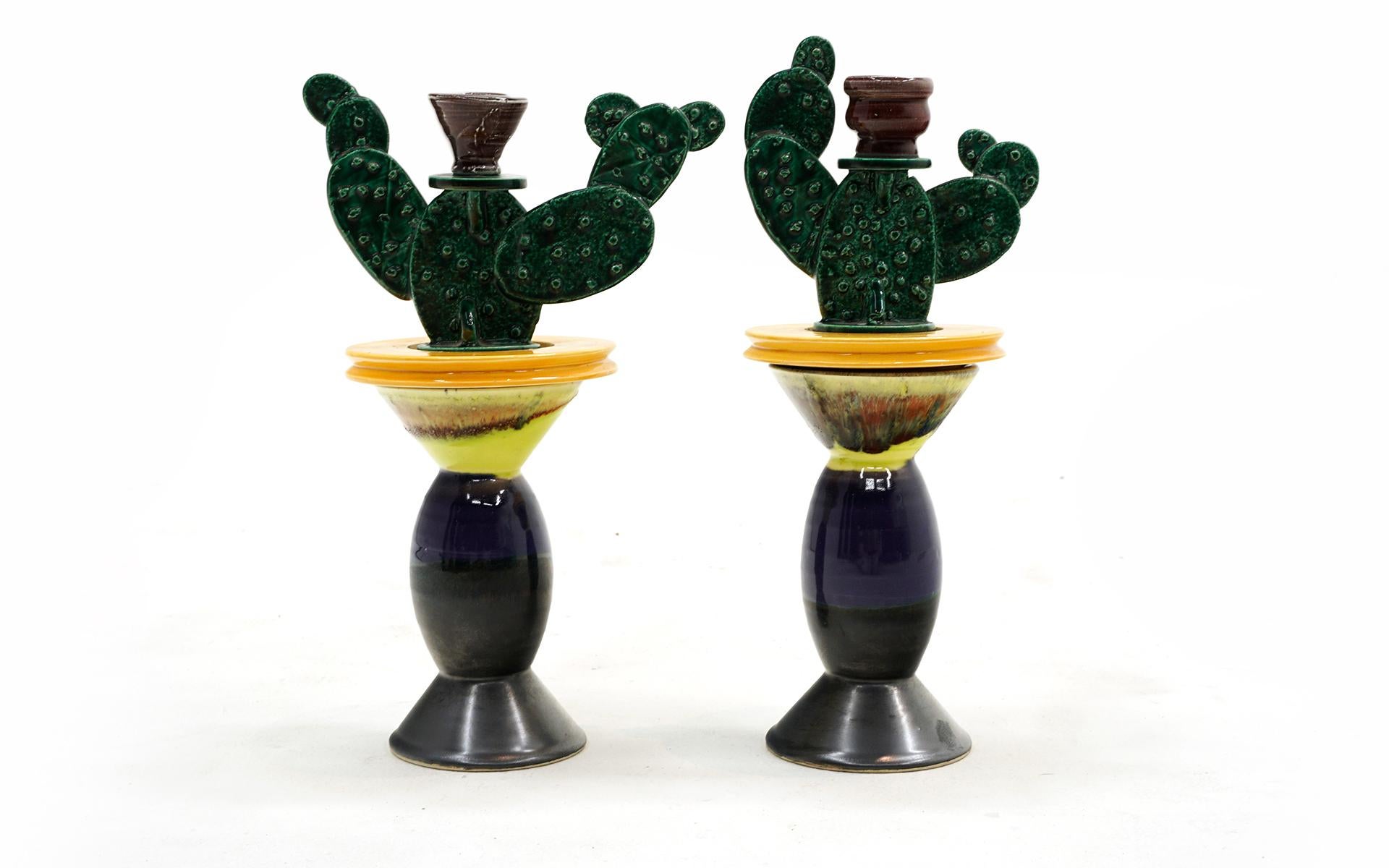 Whimsical cactus candle holders by the iconic post modern artist and designer, Peter Shire, Echo Park, CA.  Each consists of two pieces that can be used together or separately.  Mostly green, blue and yellow coloring.  Excellent condition and ready