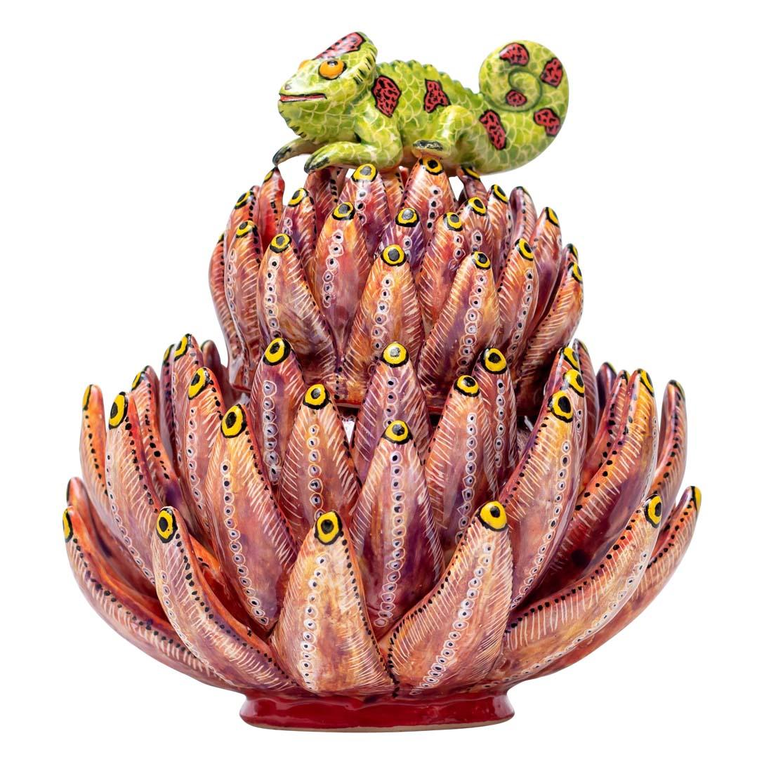 Protea Chameleon Jewelry Box
The Protea Chameleon Jewelry Box is a stunning ceramic decorative art piece that encapsulates the vibrant essence of South Africa. Designed in 2024 by Love Art Ceramic, this unique creation is sculpted by Motsamai Sello