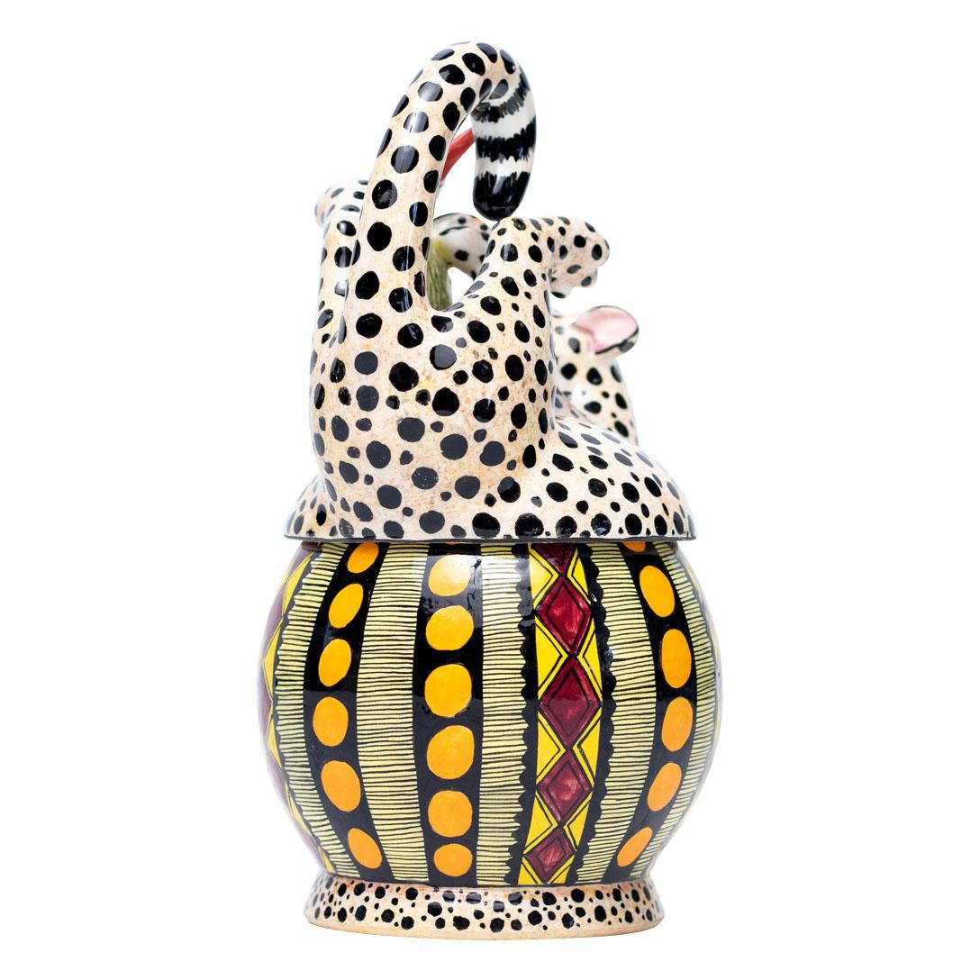 Cheetah Jewelry Box Hand Painted by Sli Mazibuko and Sculpted by Motsamai Sello
Introduce a touch of South African elegance to your home with the enchanting Cheetah Jewelry Box, a captivating piece from Love Art Ceramic. Sculpted by the talented