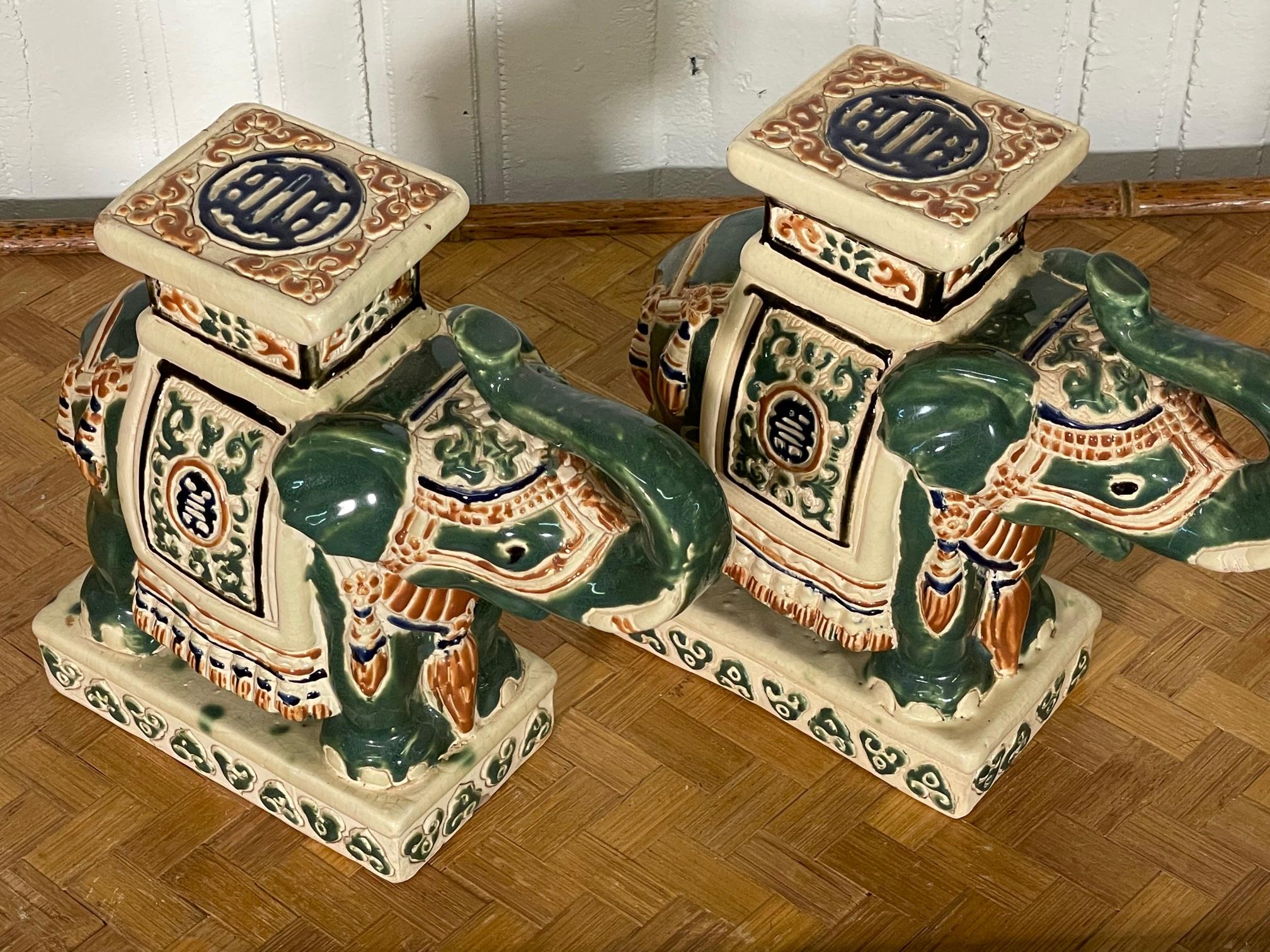 Vintage pair of ceramic elephant footstool bookends. Hand painted and fired in a glossy glaze. Very good condition with only very minor imperfections consistent with age.