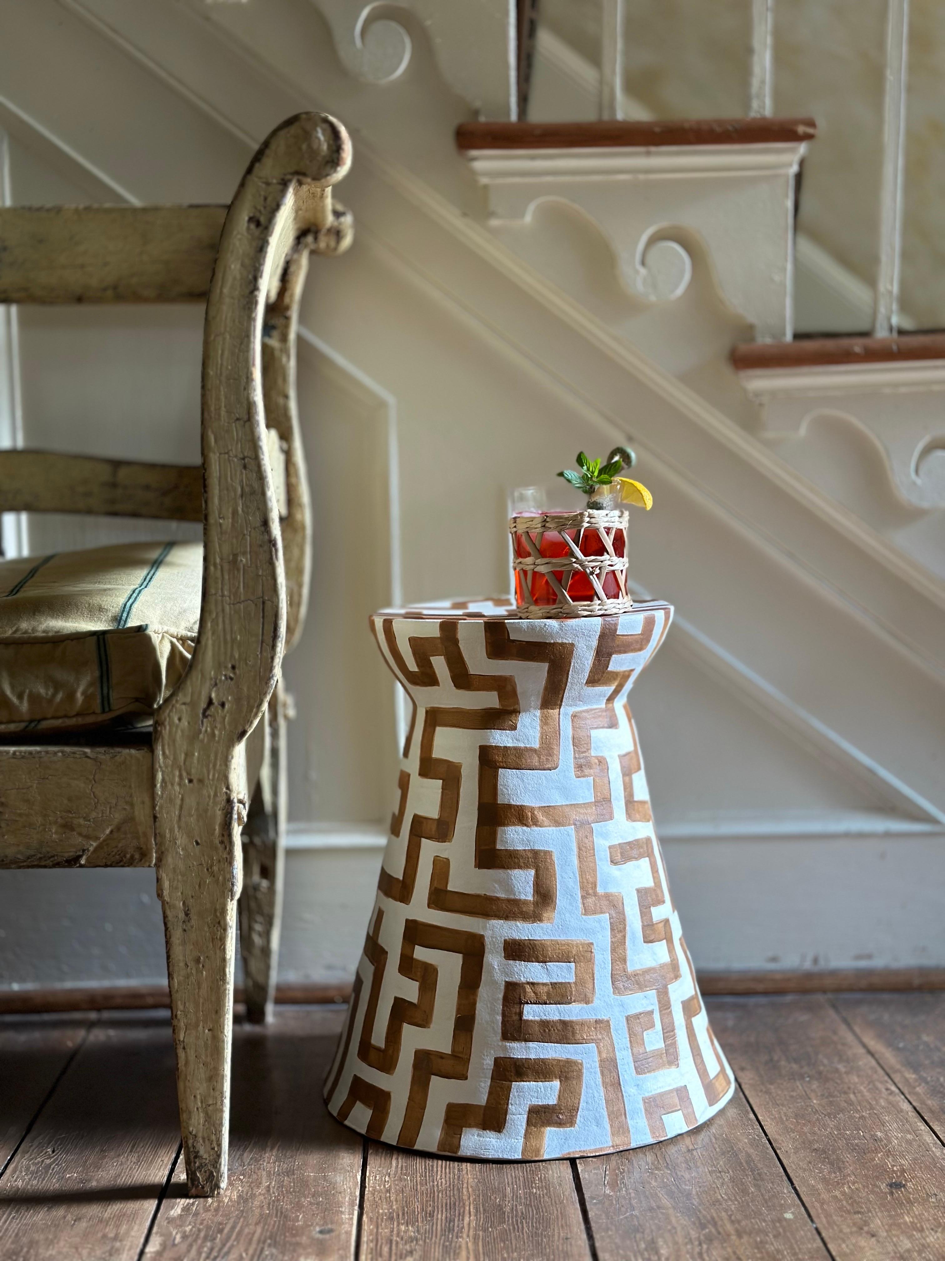 This classic form, clad in a zippy geometric pattern, gives a nod to both modern and classical modes of decoration.

13 x 13 x 16” tall  waxed matte finish,  ceramic,  pictured in saddle brown,  handmade

table comes in waxed matte finish 

Not