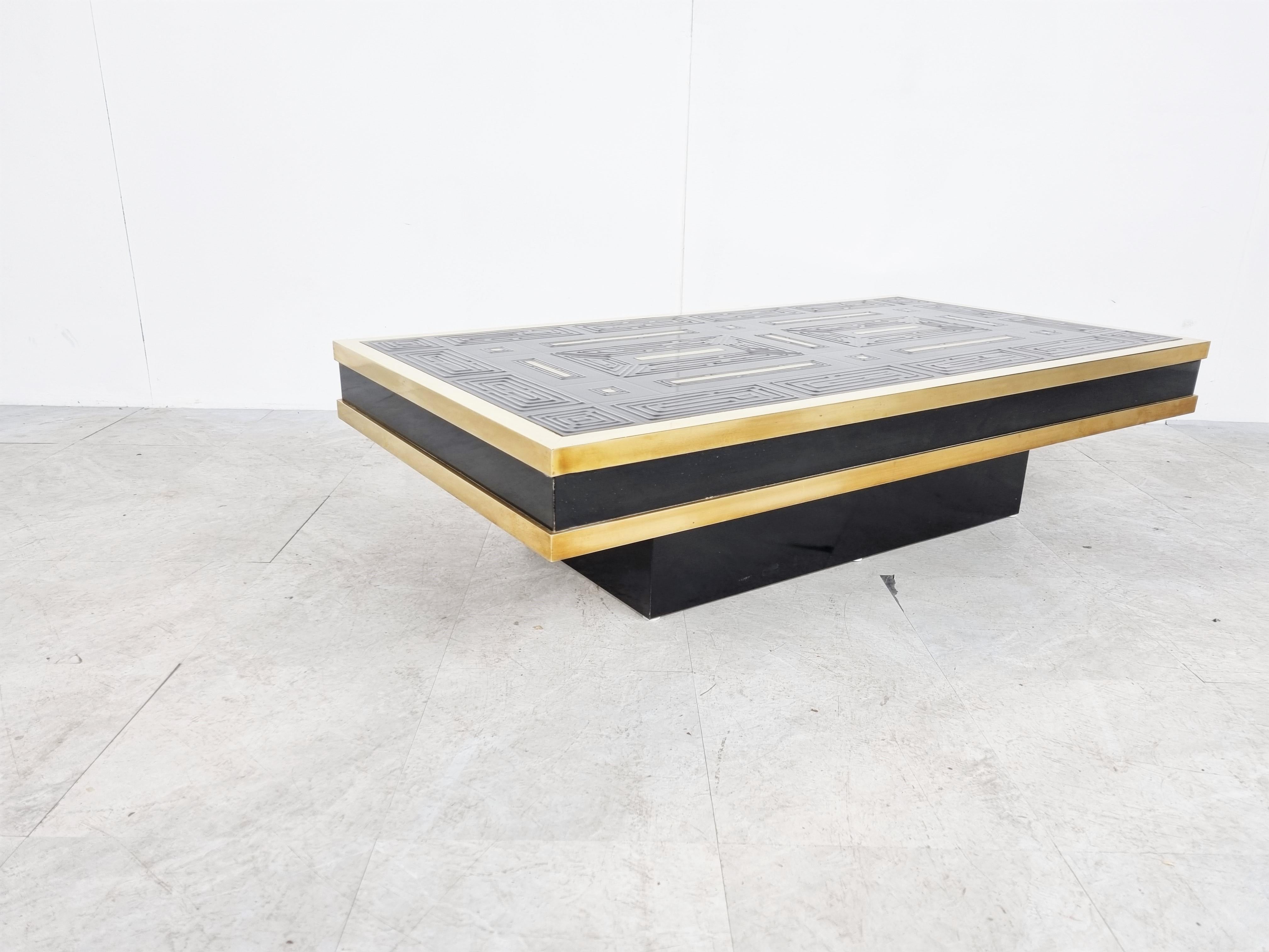Rare ceramic graphical design coffee table with black ceramic tyles and brass.

The base is made from lacquered wood.

Signed by Denisco.

Very good condition

1970s - Belgium

Dimensions:
Height: 31cm/12.20