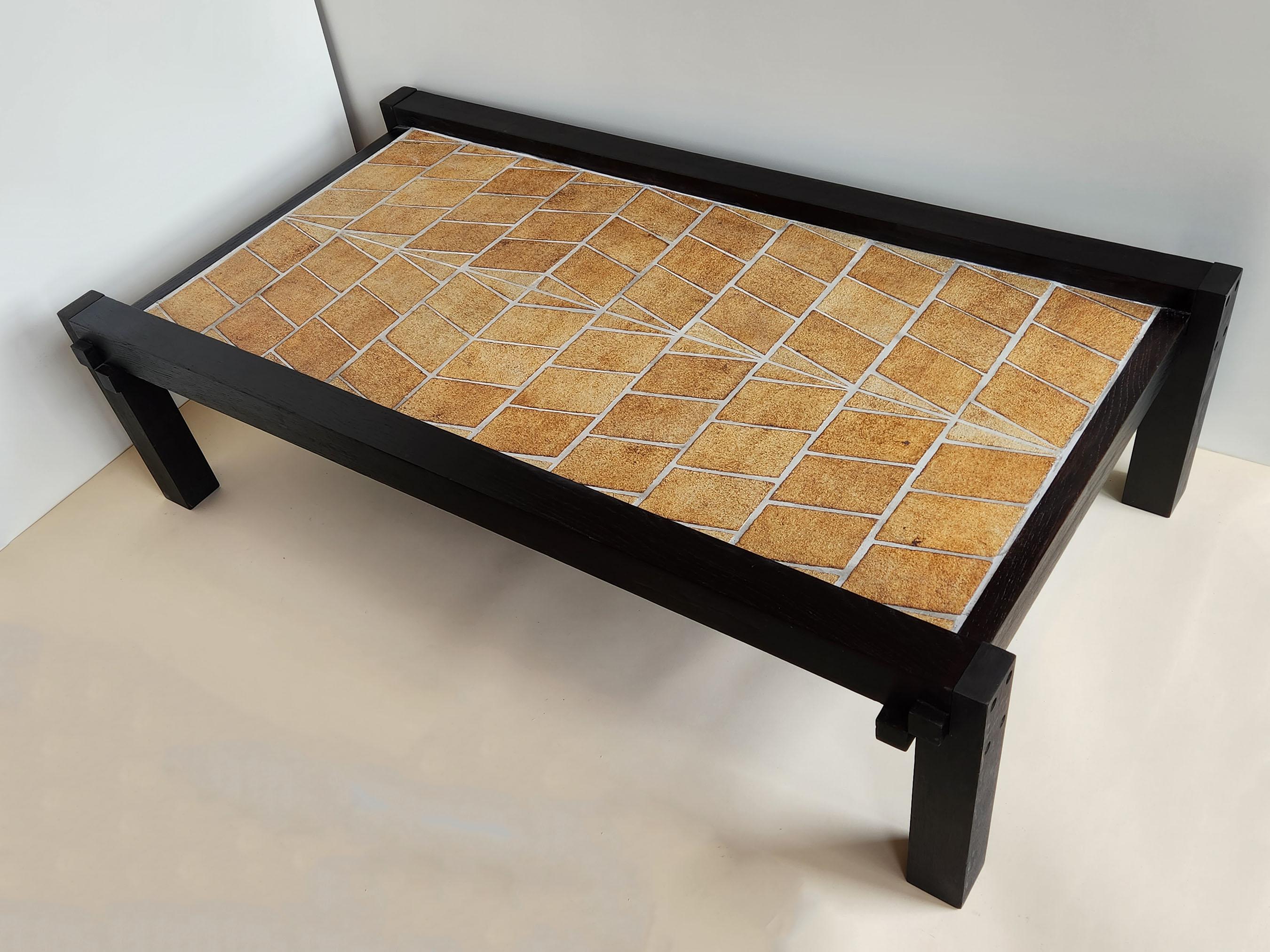 Vintage Coffee Table with Solid Clay Terra Cotta Ceramic Tiles with a Sunken Wood Frame by Roger Capron.

Vallauris, France 1970s.