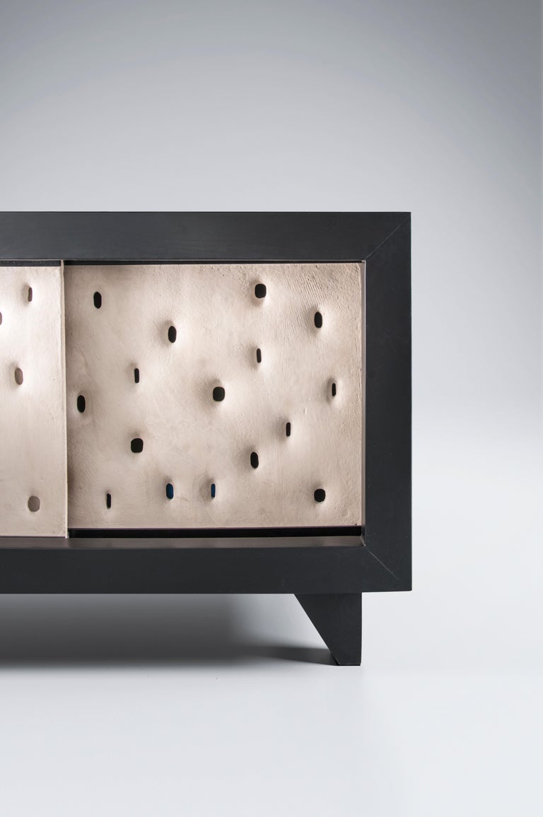 Ceramic contemporary cabinet by FAINA
Design: Victoriya Yakusha
Material: Clay, Ash
Dimensions: 175 x 50 x H 58.5 cm

Made in the style of ethnic minimalism, the collection items introduce “naive design”- simple in form, yet with a deep