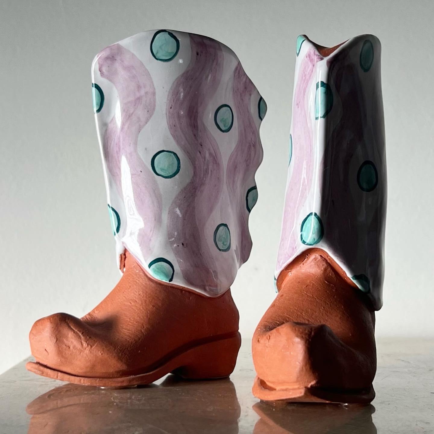 A pair of large ceramic cowboy boot salt and pepper shakers, signed by artist, late 20th century. They’re fun, they’re immaculate, they’re statement! Pick up in LA or worldwide shipping available. 
Dimensions:
2” W x 4.25” D x 6” H.
 