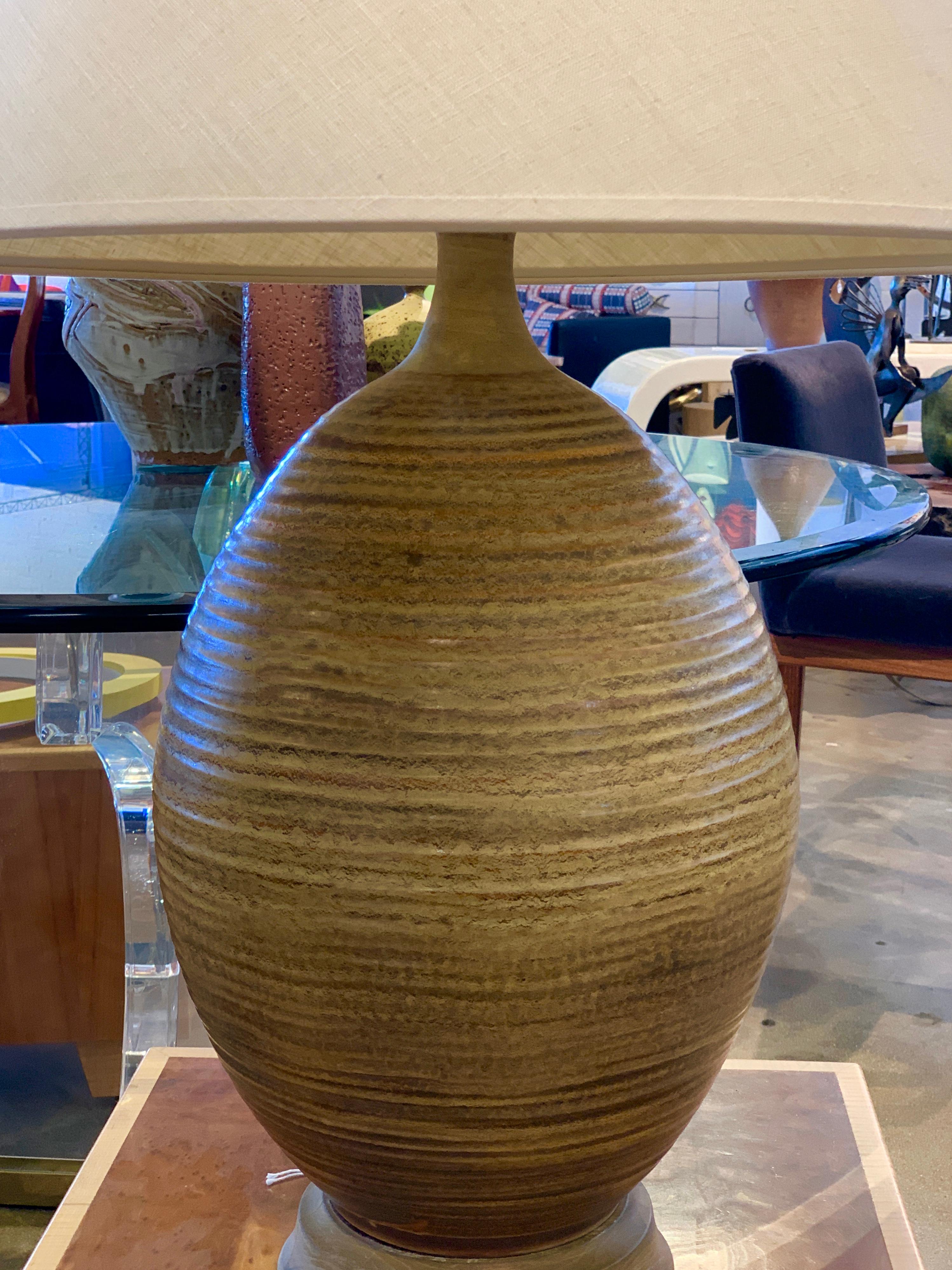 A beautiful large scale ceramic lamp by Bob Kinzie for Affiliated Craftsmen or possible David Cressey. The lamp has been rewired. The shade can be included but is stained. Please let us know if a new one is required. Great scale and presence. The