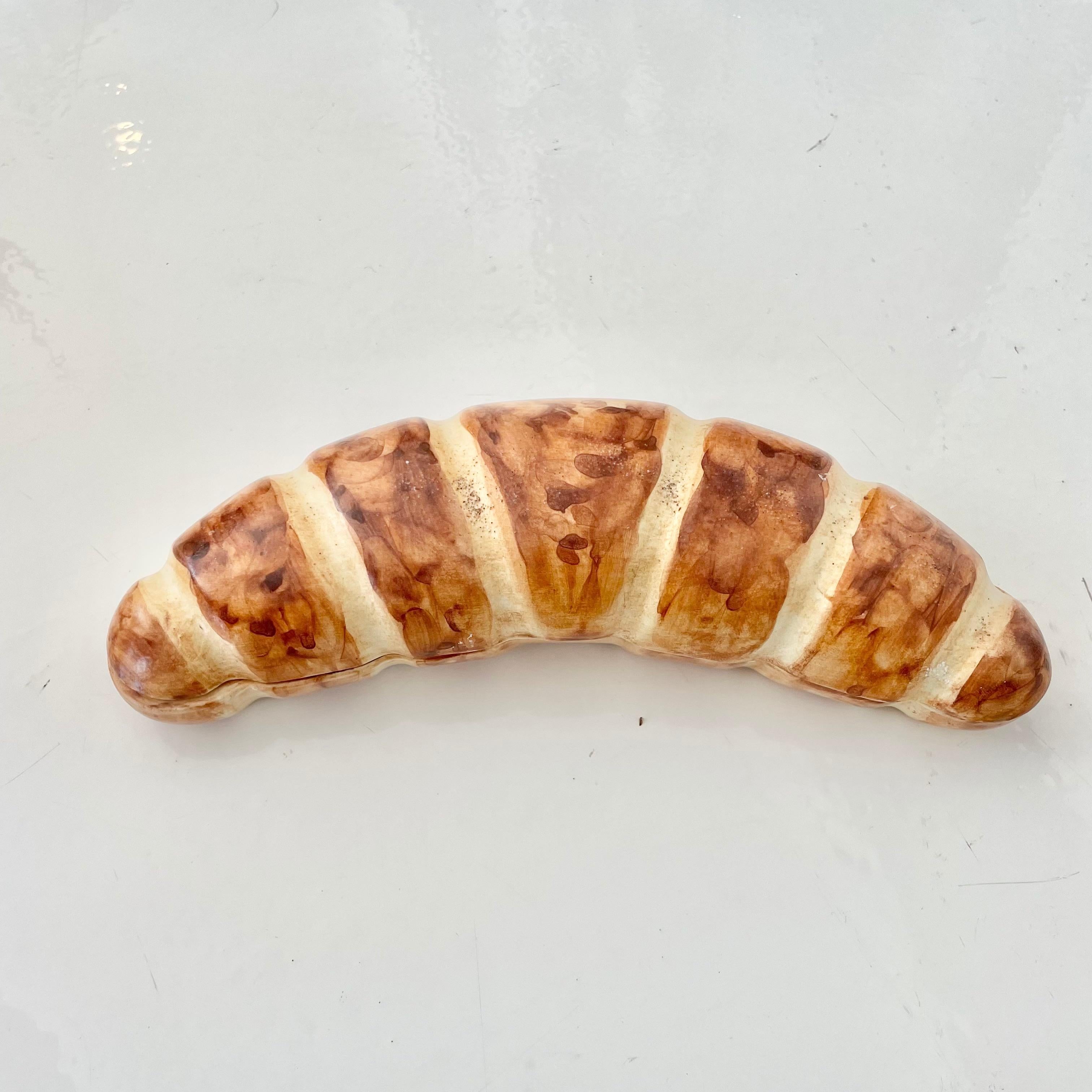 Fantastic ceramic croissant by Raymor. Underside reads 