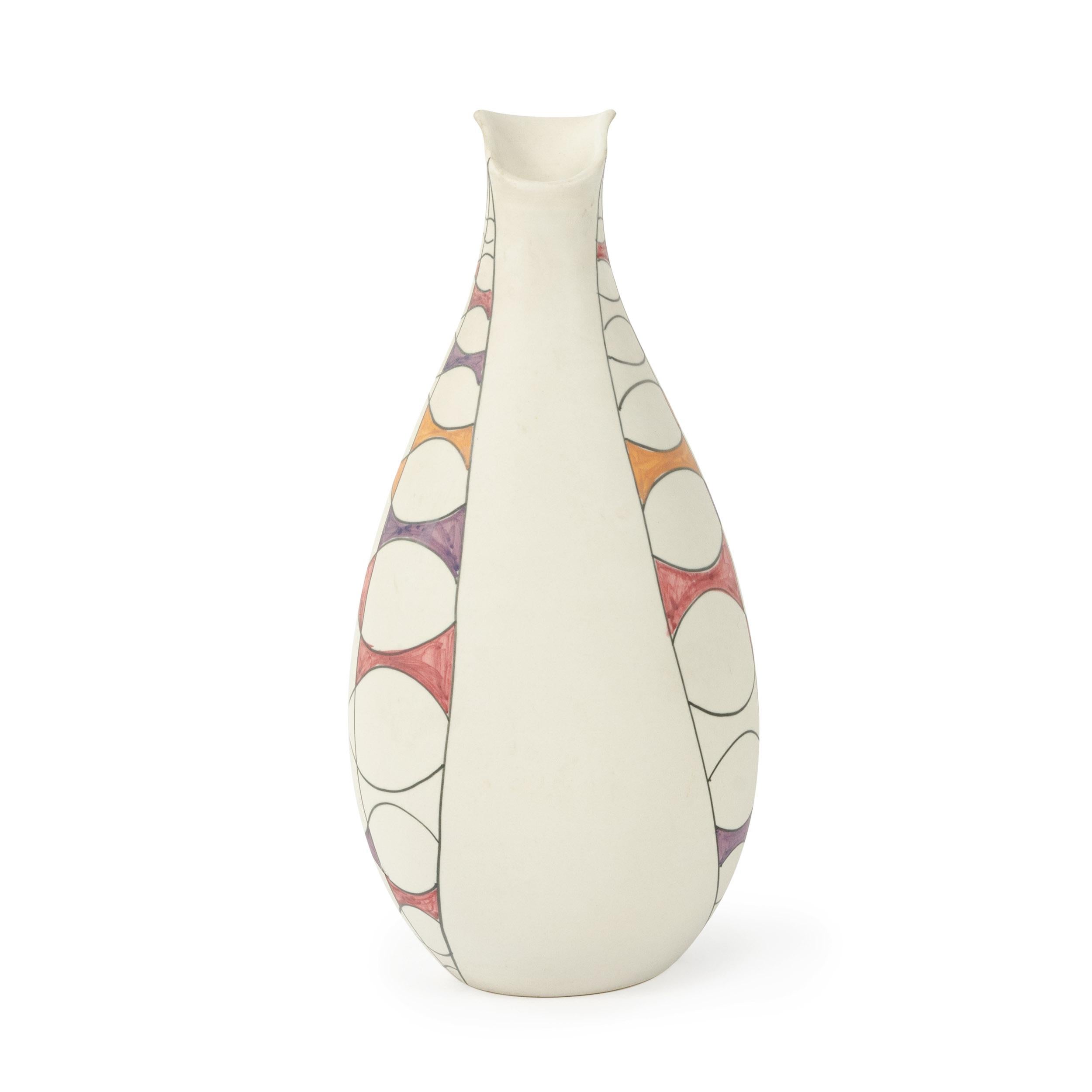 A ceramic vase dipped in white slip and under glazed with curved geometries in pink, yellow and purple. Made in Italy by Raymor, circa 1960s. Marked 'Italy R221 Raymor'.