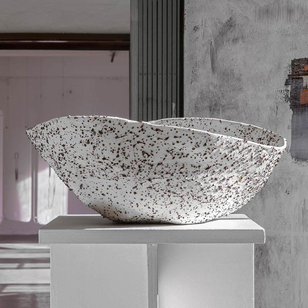 Enjoy a nice big bowl of 'Stracciatella', by Tellurico, a multidisciplinary design studio based in the Netherlands. This centerpiece-worthy, one-of-a-kind, generously-sized vessel contains volcanic lava stones gathered from the hills of the