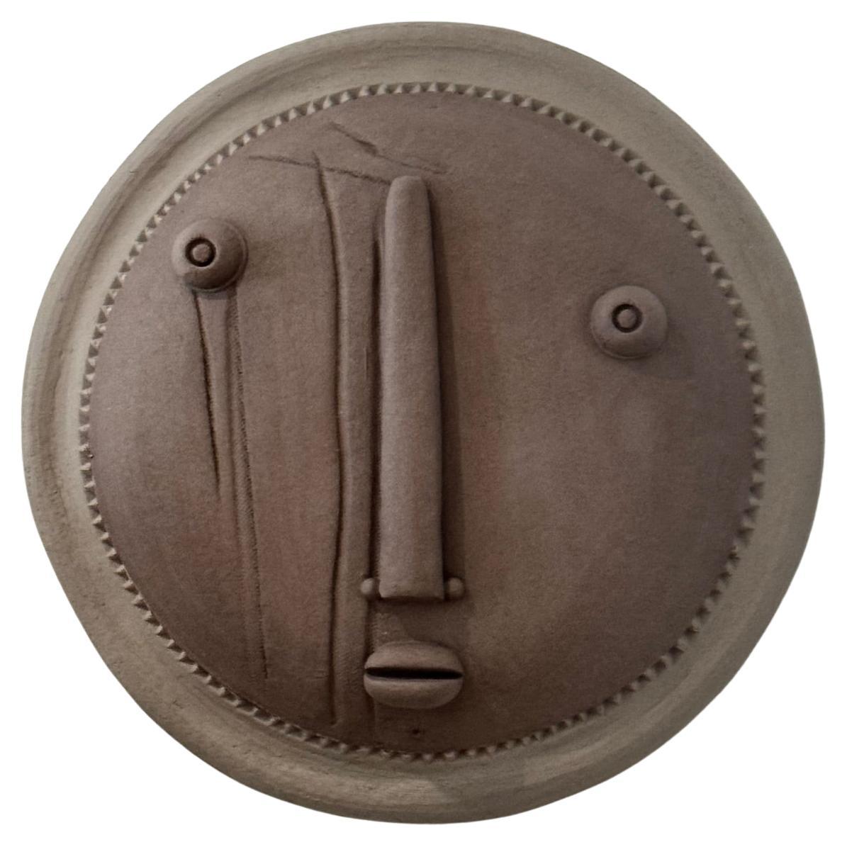Maschera decorativa in ceramica firmata da Dalo