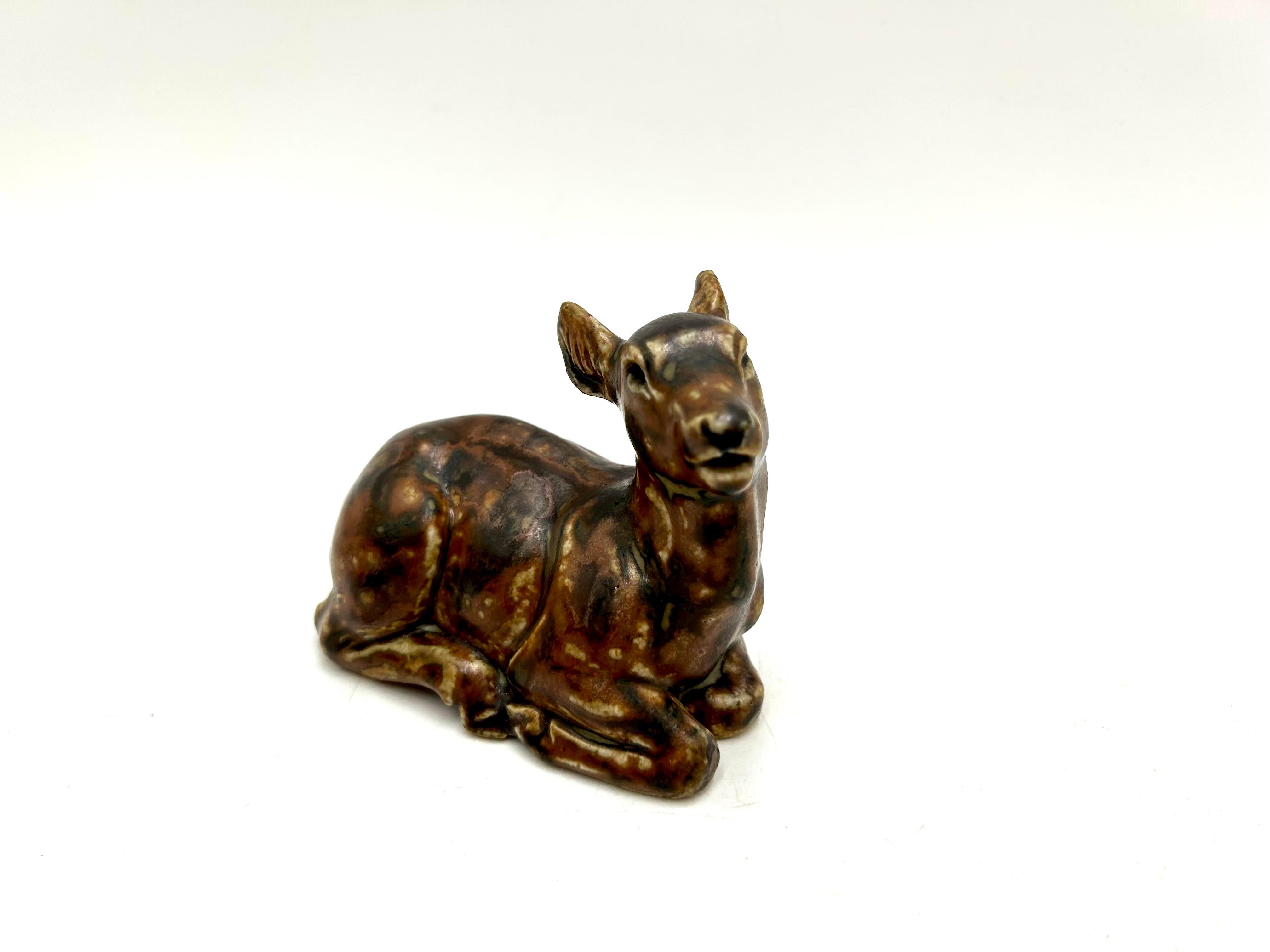 Ceramic deer figurine, made of stoneware, designed by Knud Kyhn

Made in Denmark by Royal Copenhagen.

Very good condition, no damage.

height 8cm, width 10cm, depth 5cm