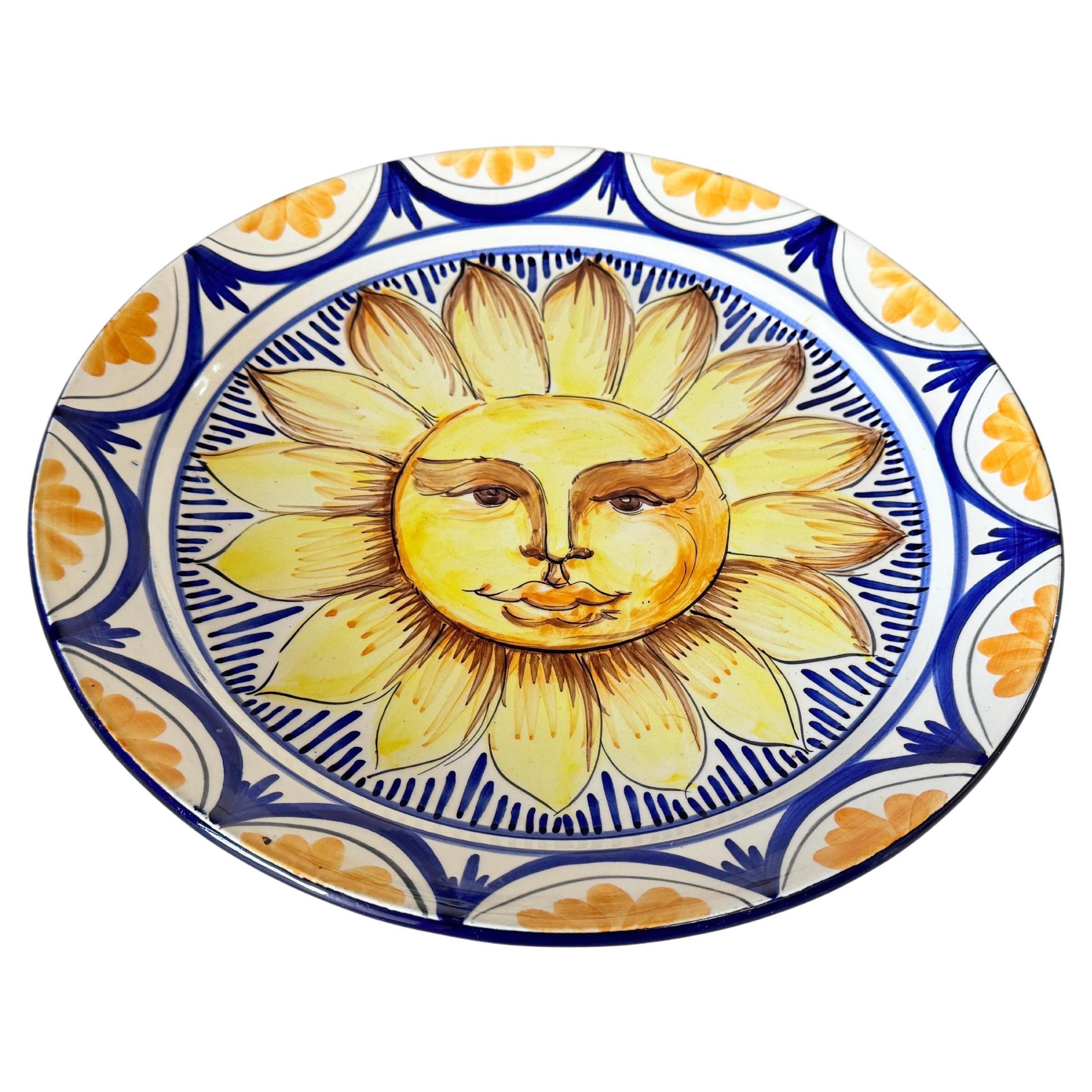 Plat en céramique jaune et bleu Italie 20e siècle représentant le soleil