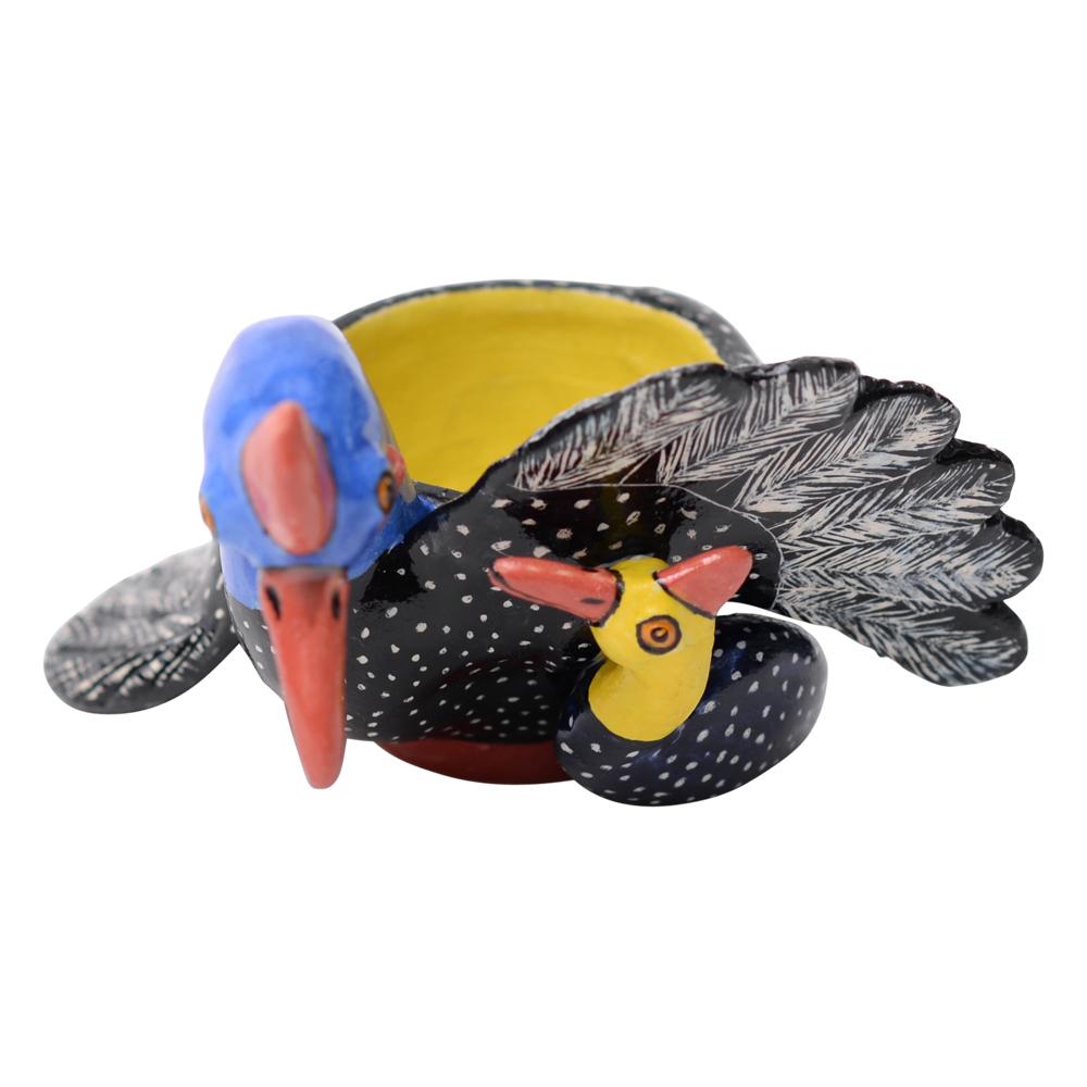 The ceramic Guinea Fowl Egg Cup, meticulously crafted by Sbu and hand-sculpted by Saiza at Love Art Ceramic in South Africa, captures the essence of African wildlife. Standing at 2 inches high, 4 inches in length, and 2 inches in width, it portrays