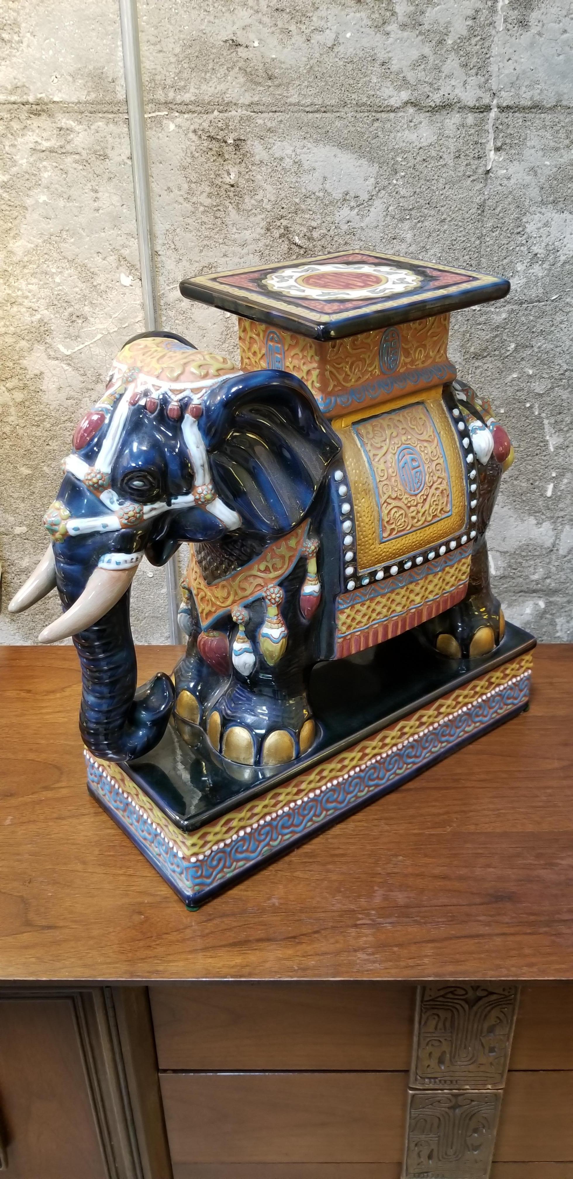 A vintage Asian ceramic elephant garden stool or end table with a vibrant, polychrome glaze. Notice fine detail to casting. Excellent condition. Retains paper label, 