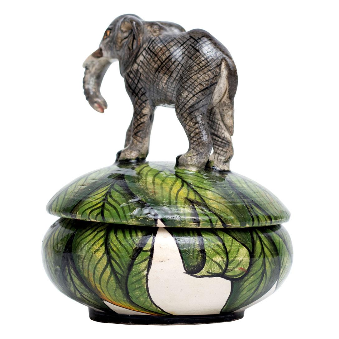This exquisite ceramic elephant jewelry box is a testament to the rich artistry and cultural heritage of South Africa. Hand-sculpted by Bennet Zondo and hand-painted by Samukelo Gumede at Imvelo Natural Art, this charming piece stands 5 inches high,
