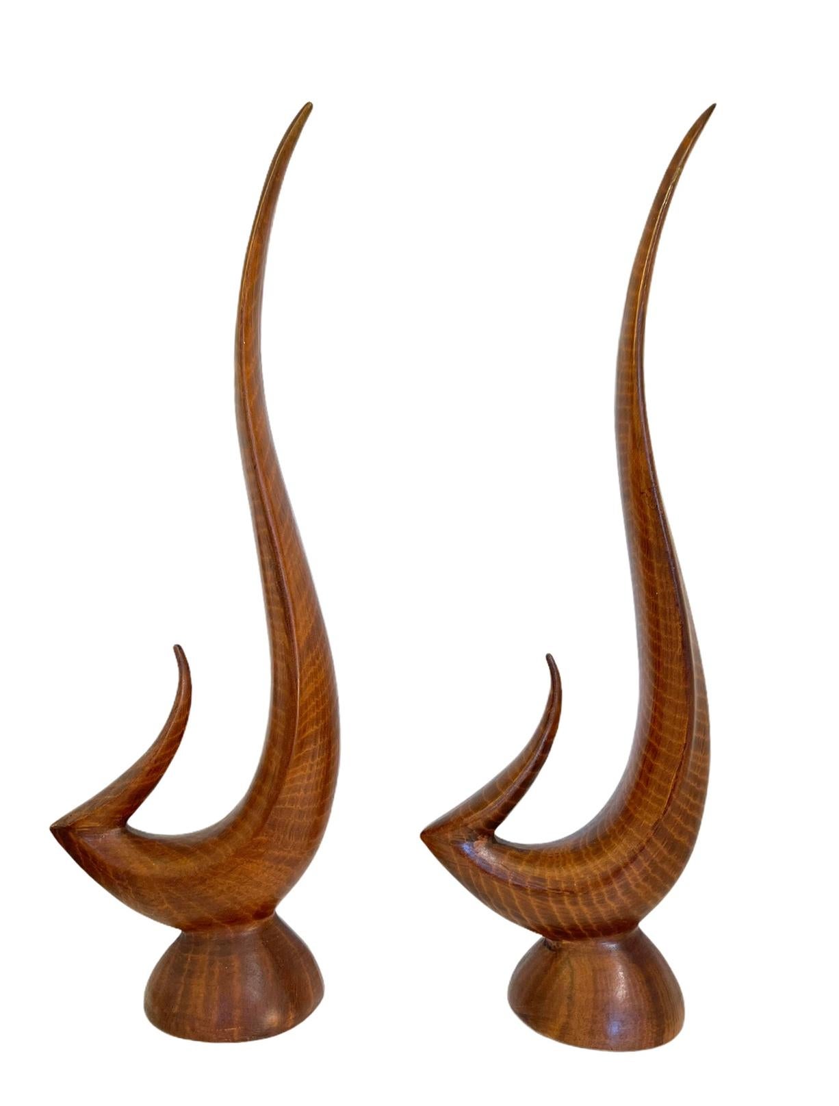 Mid century ceramic faux bois sculpture pair. Add incredible shape and movement to any space. 

Faux bois (from the French for false wood) refers to the artistic imitation of wood or wood grains in various media. The craft has roots in the