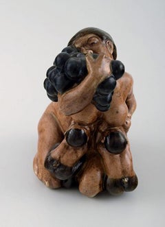 Ceramic Figurine of a Kneeling Woman with Fauns and a Bunch of Grapes