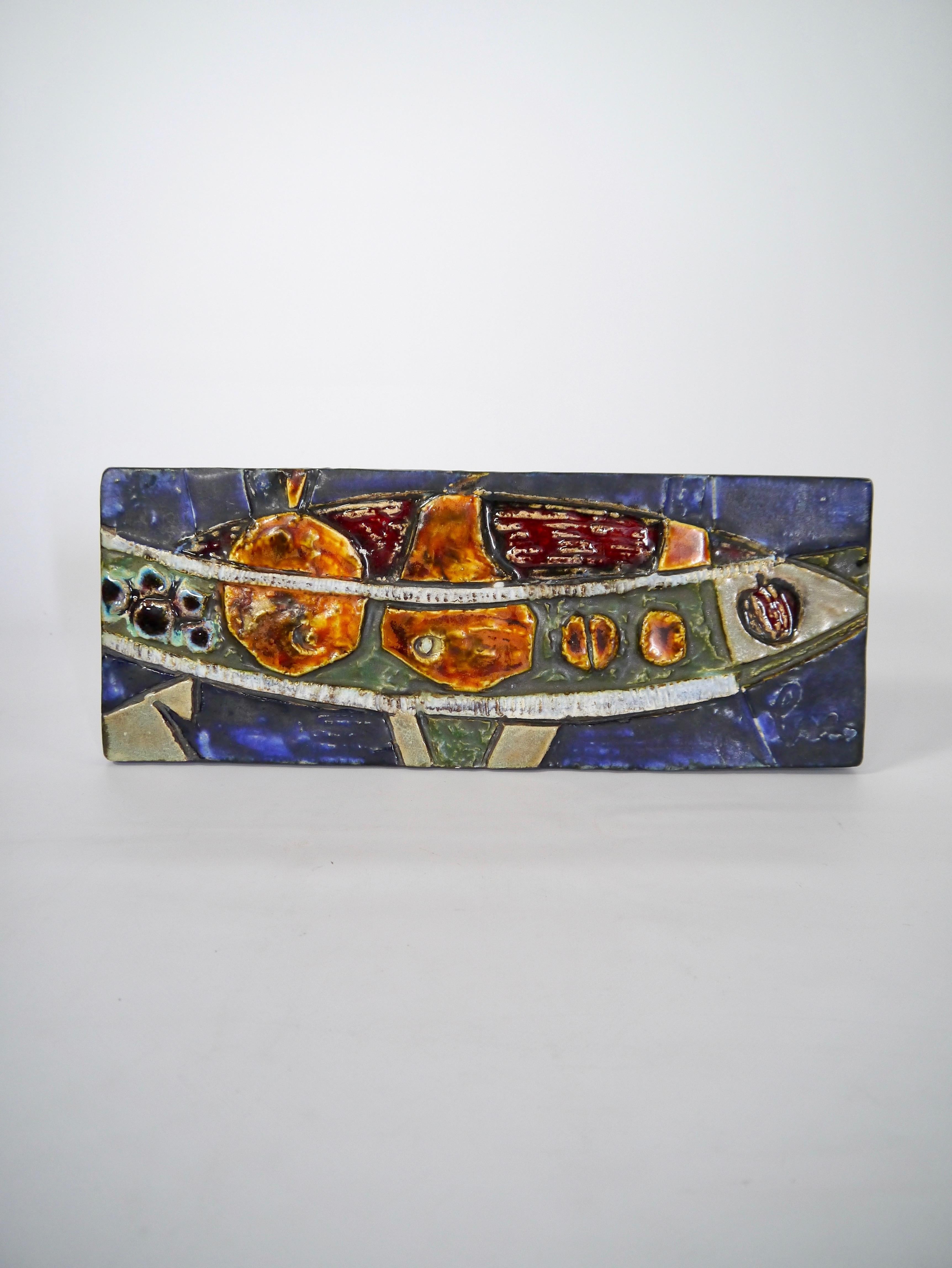 Ceramic fish wall plaque made by esteemed German ceramist Helmut Friedrich Schäffenacker, Germany 1950s. The piece shows his signature traits; simplified, abstract & geometric shapes and deep & rich glaze. 