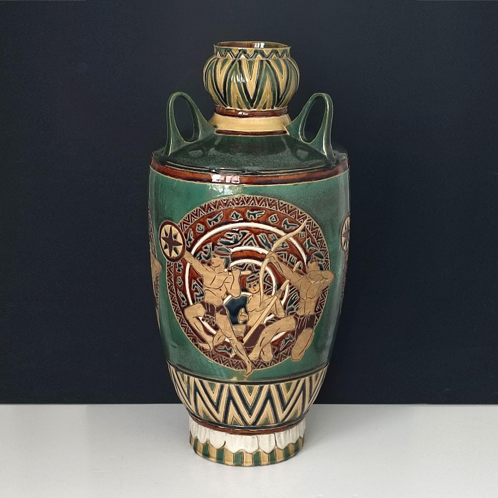 Ceramic floor vase decorated with 3 top handles and 3 round scenes with antique warriors. Designed incised and glazed. Very good vintage condition.
Measures: Height 57 cm.