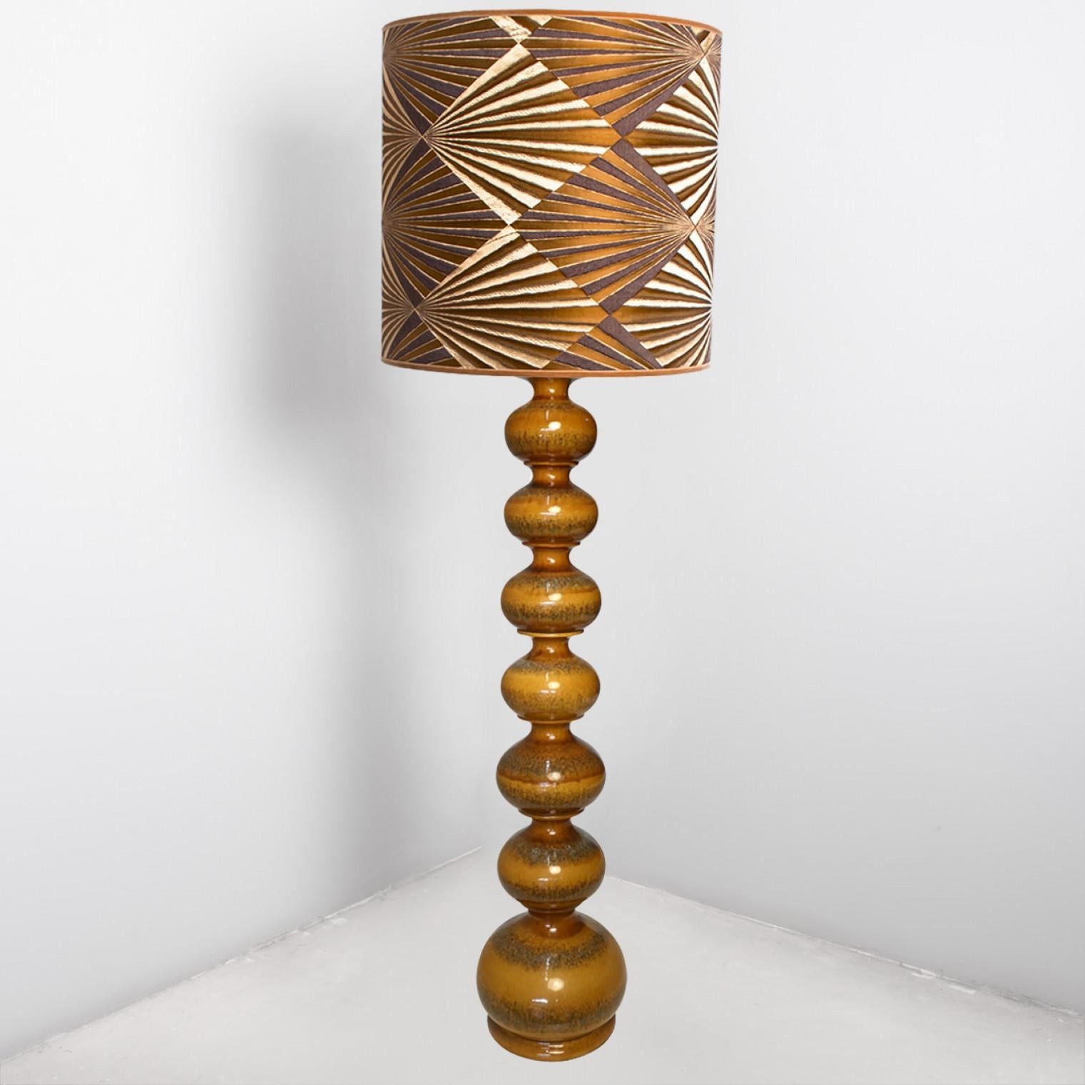 Exceptional ceramic bubble floor lamp by Kaiser, Europe, Germany, 1960s. Beautiful sculptural piece handmade ceramic in rich glazed brown tones. With special new custom made  silk lamp shade whit fabric from Dedar and warm bronze/gold inner shade.
