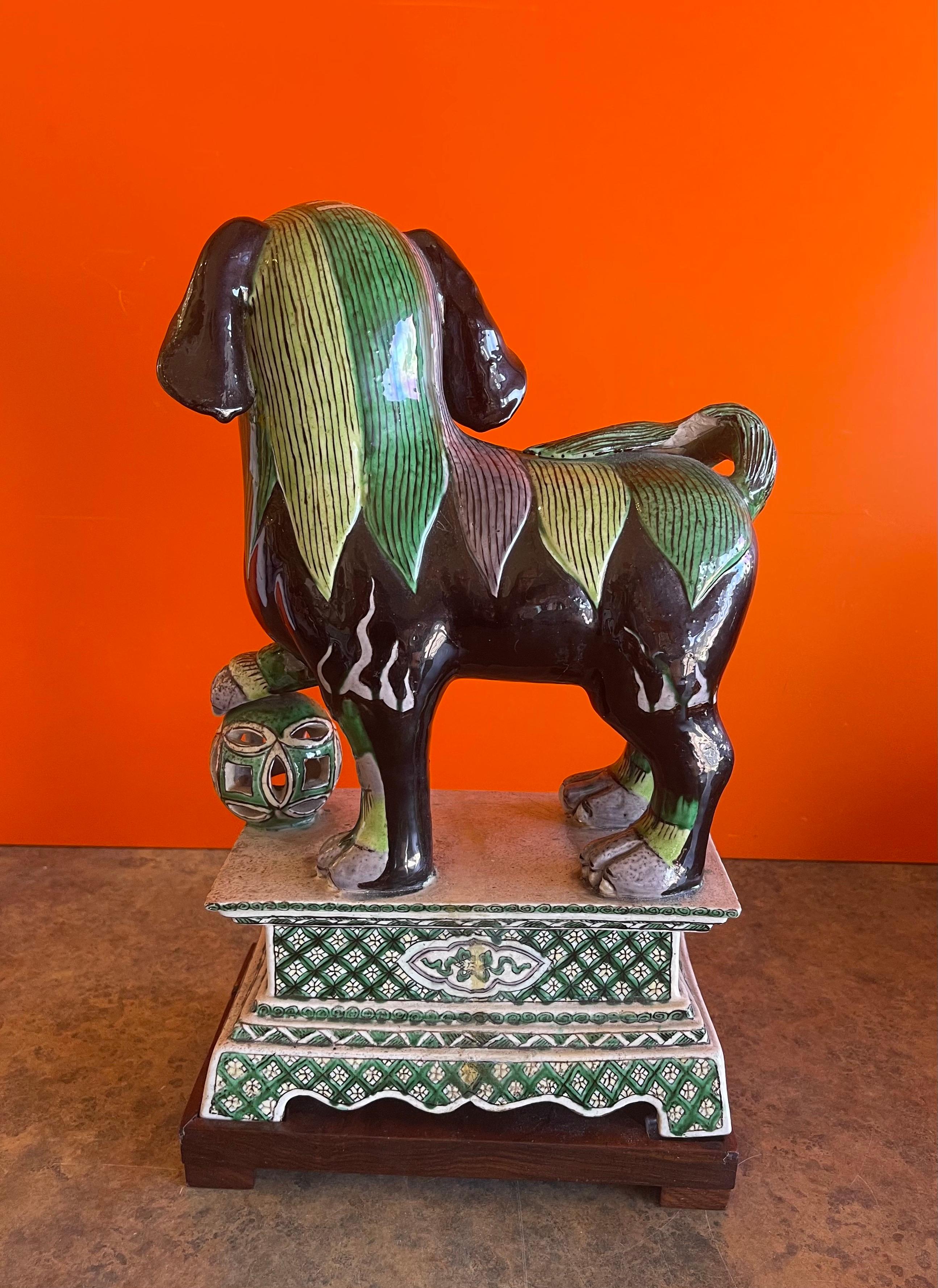 Ceramic Foo Dog Sculpture on Mahogany Base In Good Condition For Sale In San Diego, CA