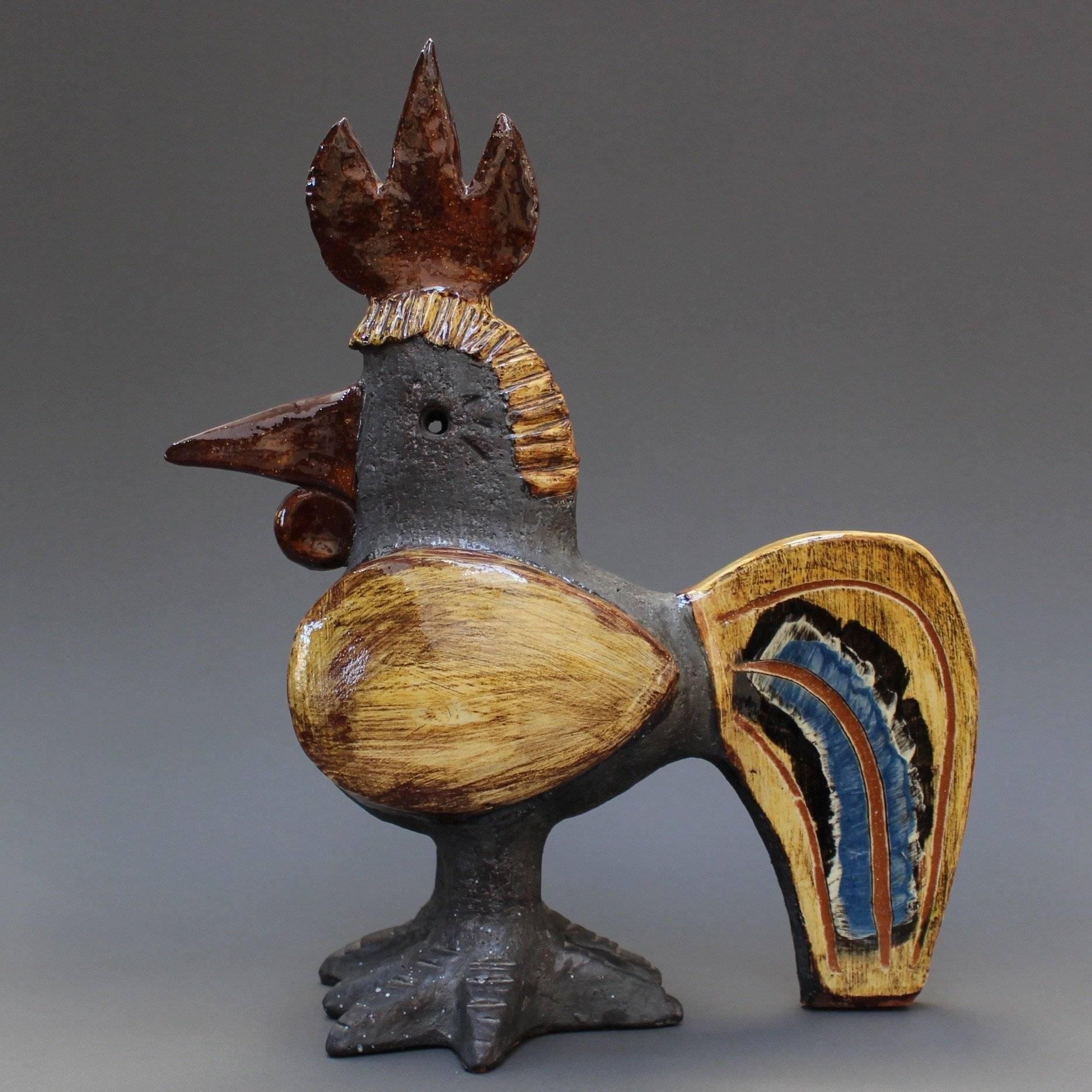 Ceramic French Rooster(s) by Dominique Pouchain, (circa 1990s). This whimsical coq is pure joy to look at and to display. The artist himself indicated he had so much fun in its creation. The body is flat black with etched markings; the wings, tail,