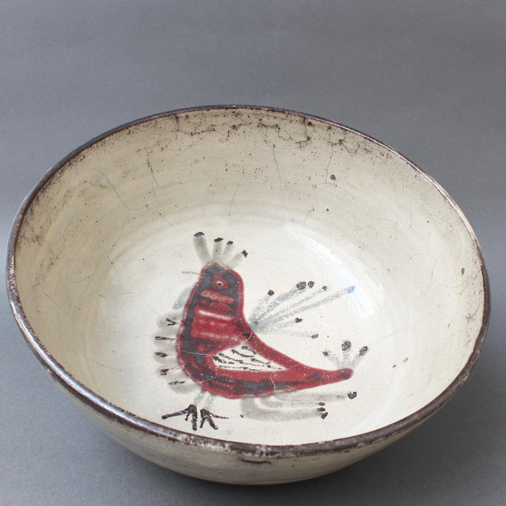 'Ceramic French rooster motif bowl' by Gustave Reynaud - Le Mûrier, circa 1950s. Earthenware bowl with decor of a stylised French red rooster. The rooster is mulberry red with white feathers over the pale white background of the glaze. In fair