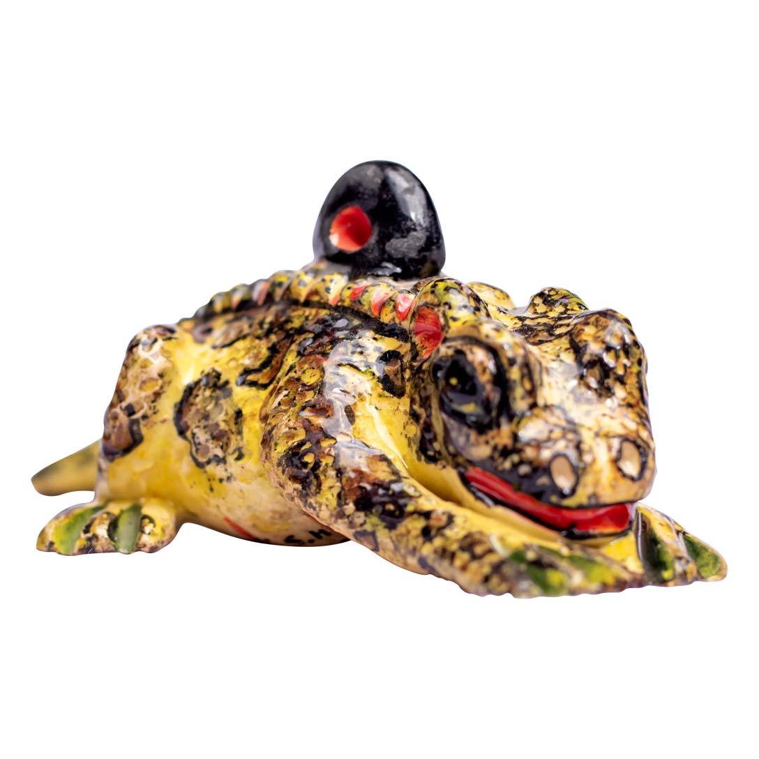 This colorful ceramic frog ornament, crafted by Zimele Ceramics in South Africa, is a lively representation of one of nature’s most adaptable creatures. Hand-sculpted by Mbeke and beautifully painted by Sihle, this piece measures 1 inch high, 4