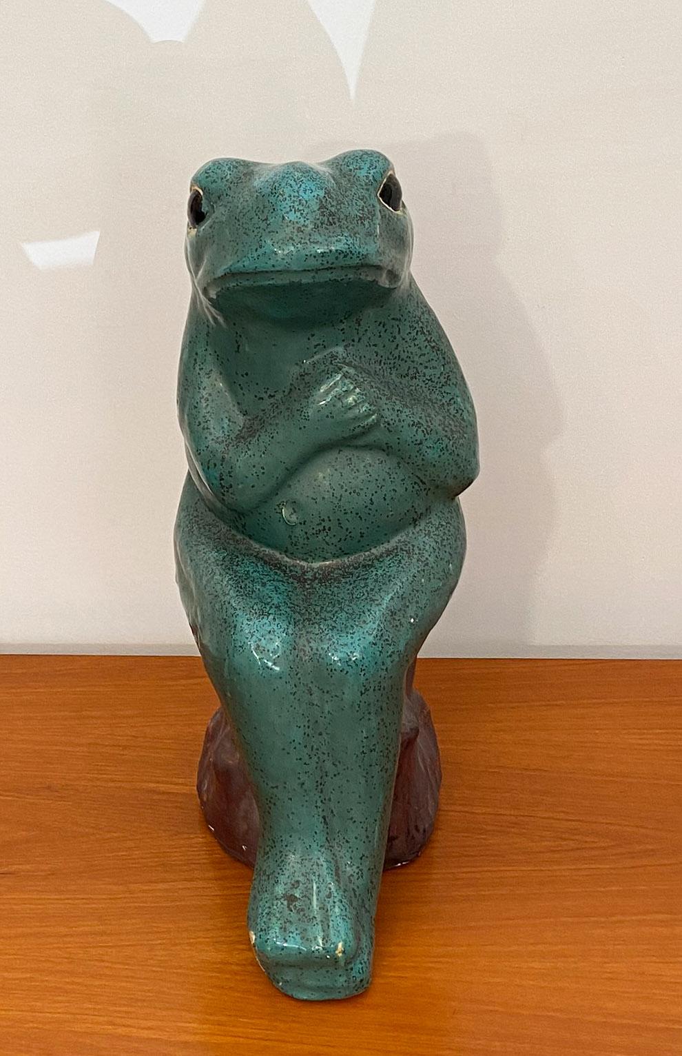Unusual Ceramic frog sitting on a trunk, in the style of Jerome Massier, Italy, 1960s.