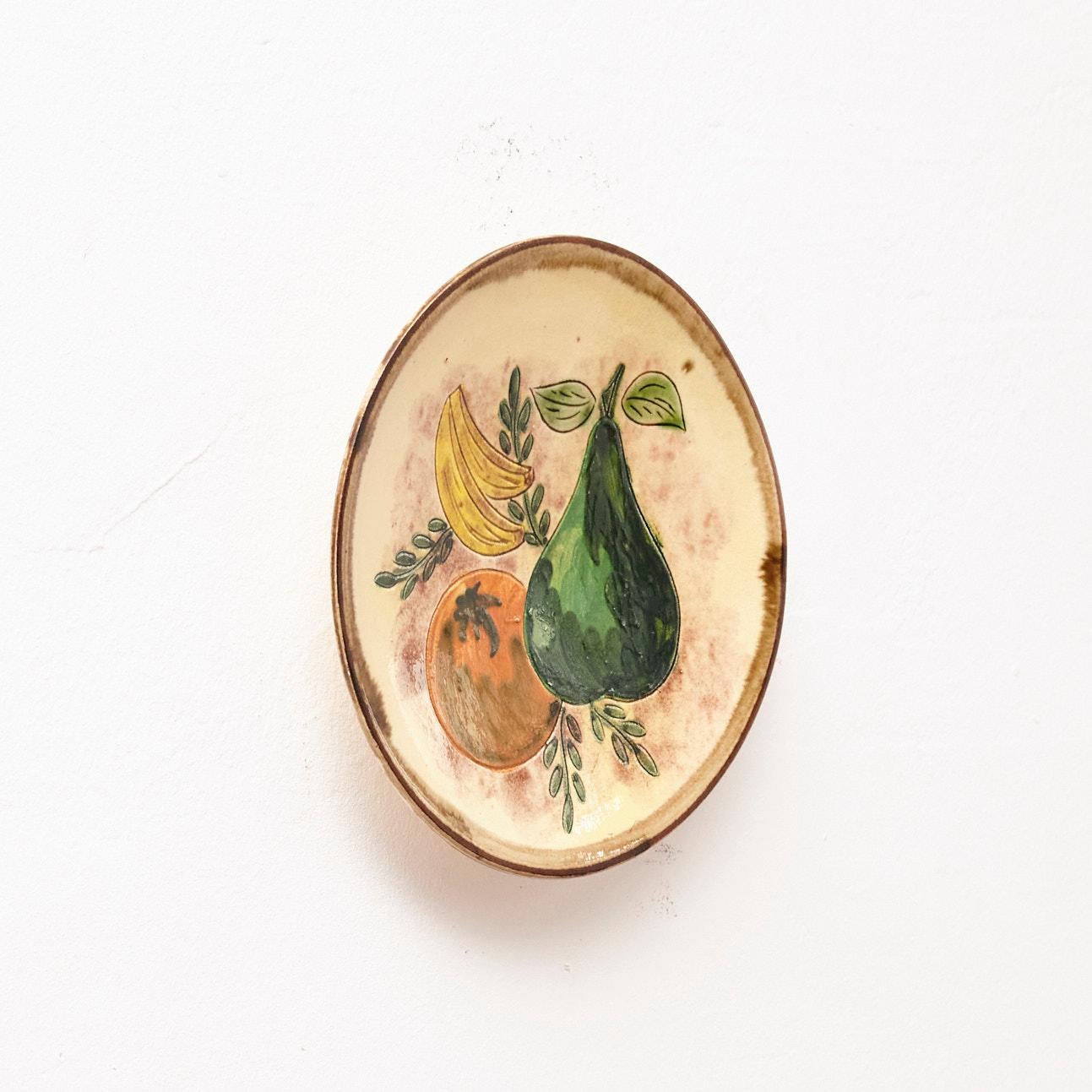 Manufactured France, circa 1950.

Materials:
Ceramic

Dimensions: 
Diam. 23,5 cm x H 2,8 cm

The artwork is in its original condition, showing minor signs of wear consistent with its age and use. These imperfections contribute to the artwork's