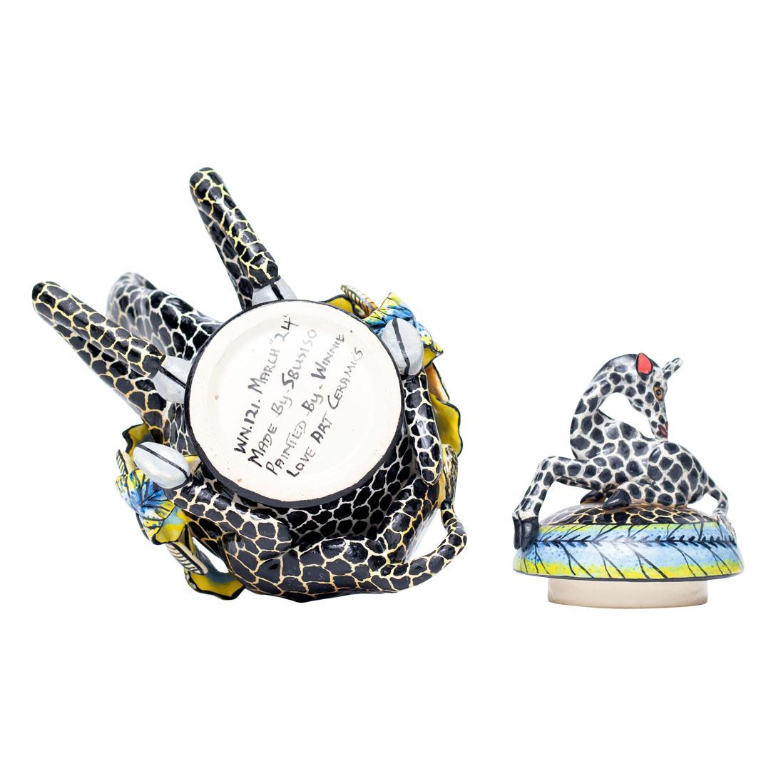 Giraffe Jewelry Box
Hand Painted by Winnie and Sculpted by Sbusiso

The Giraffe Jewelry Box is a stunning piece of ceramic art crafted by the talented artisans Winnie and Sbusiso at Love Art Ceramic in South Africa. Measuring 8 inches in height, 10