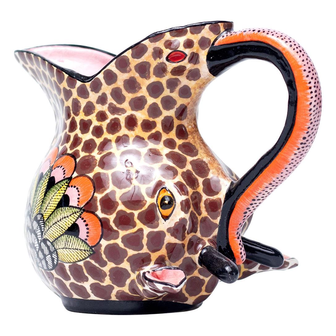 Giraffe Jug Hand Painted by Jabu Nene and Sculpted by Motsamai Sello from Love Art Ceramic

This exquisite Giraffe Jug is a stunning piece of decorative art crafted in South Africa by the talented duo Jabu Nene and Motsamai Sello at Love Art