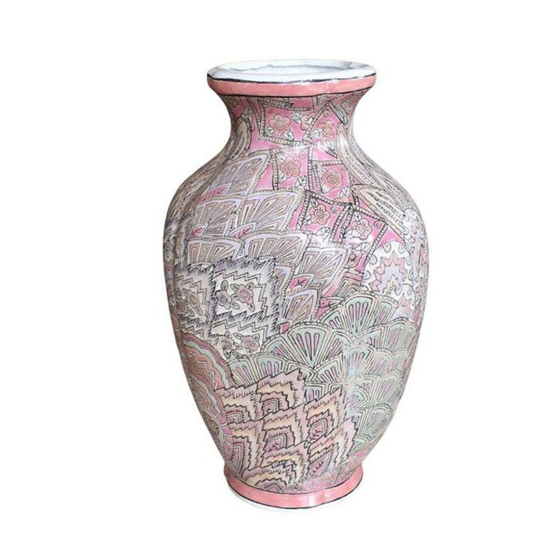 A lovely flame stitch pattern ceramic vase in pink. This rare famille rose vessel has a pattern unlike any other we have ever seen. Beautiful pastel pinks, light blues, and creams make this vessel a unique addition to any table. The pattern