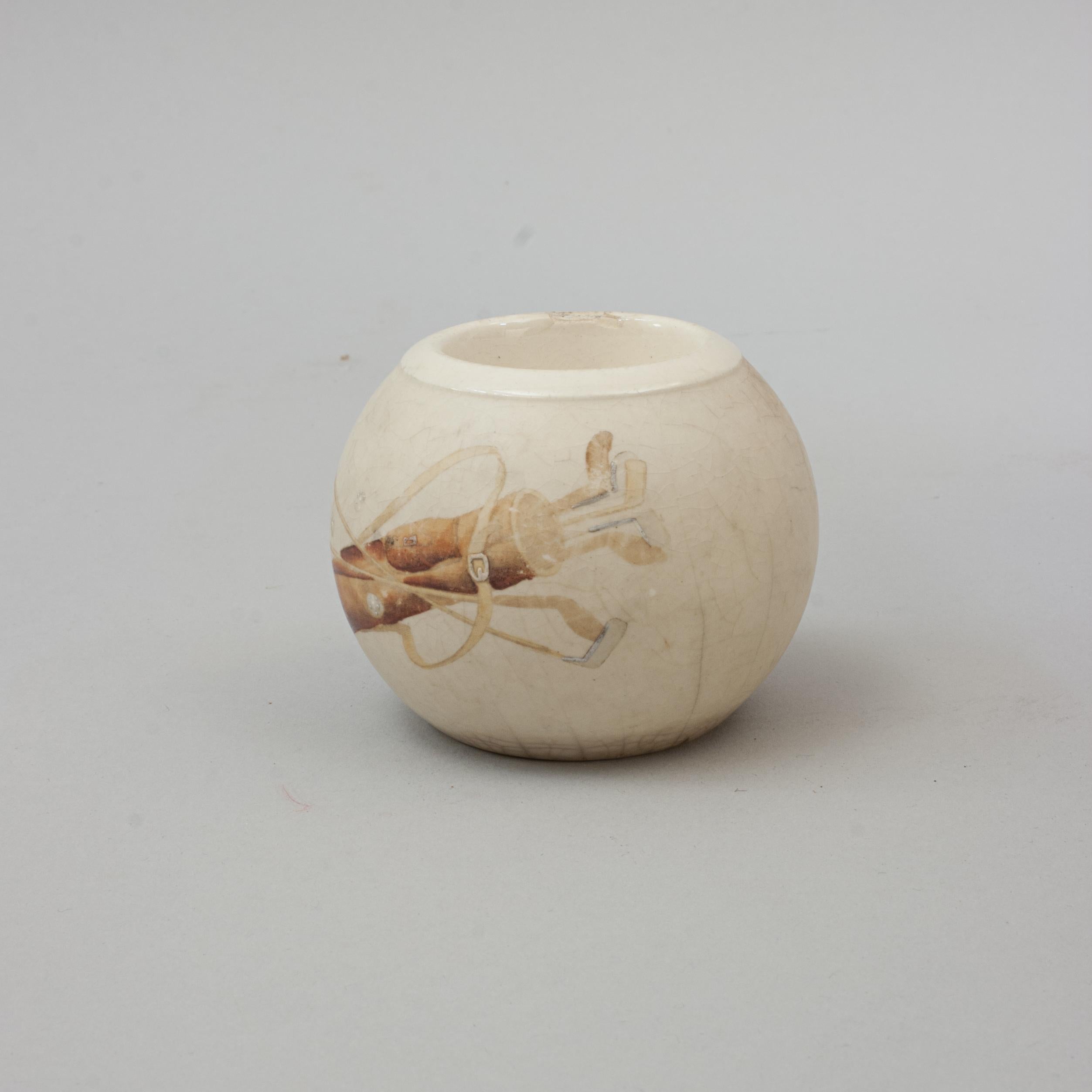 Ceramic Golf Match Holder.
A rare golf match or vesta holder with colour golfing scene to the front showing a pencil golf bag full of hickory golf clubs, transfer image with hand finishing. The base is marked 'B3249d' and is a great piece for the