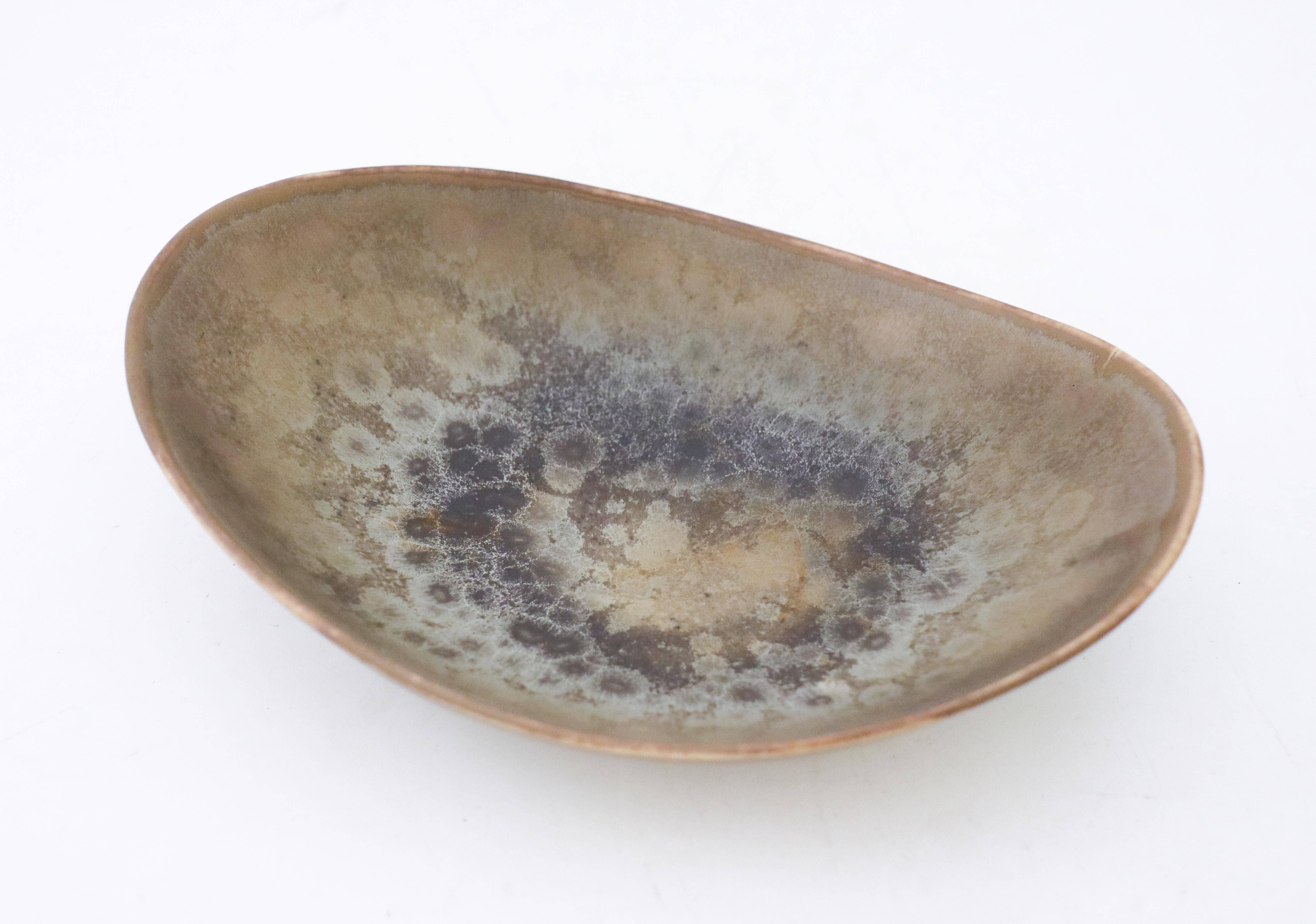 A lovely gray bowl designed by Carl-Harry Stålhane at Rörstrand, the bowl is 19 x 14 cm. It is in very good condition except from a minor crack from the production why it is marked as 2nd quality. 

Carl-Harry Stålhane is one of the top names when