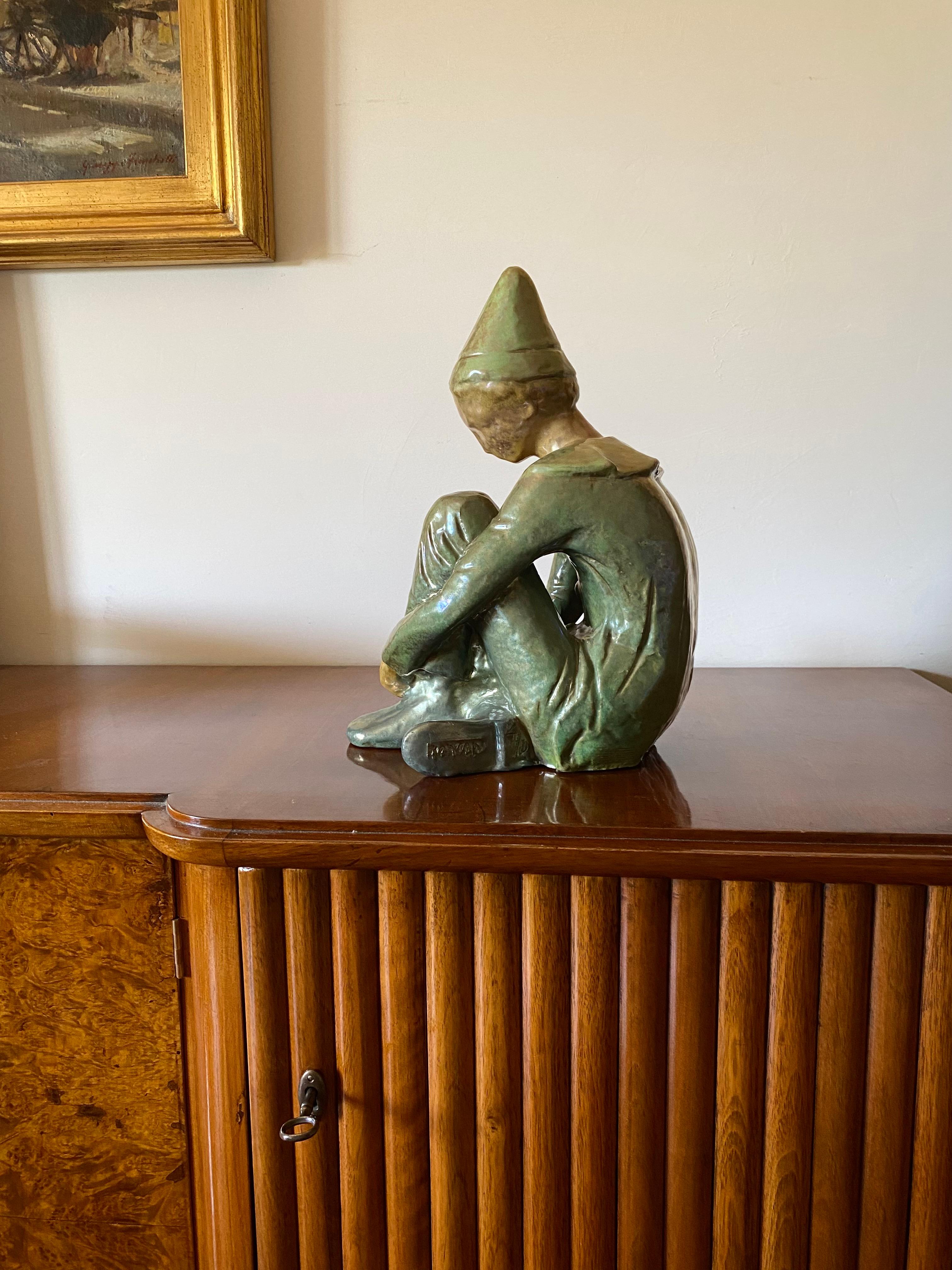 Italian Ceramic green figure of Sitting boy, Giordano Tronconi, Faenza Italy, 1950s For Sale
