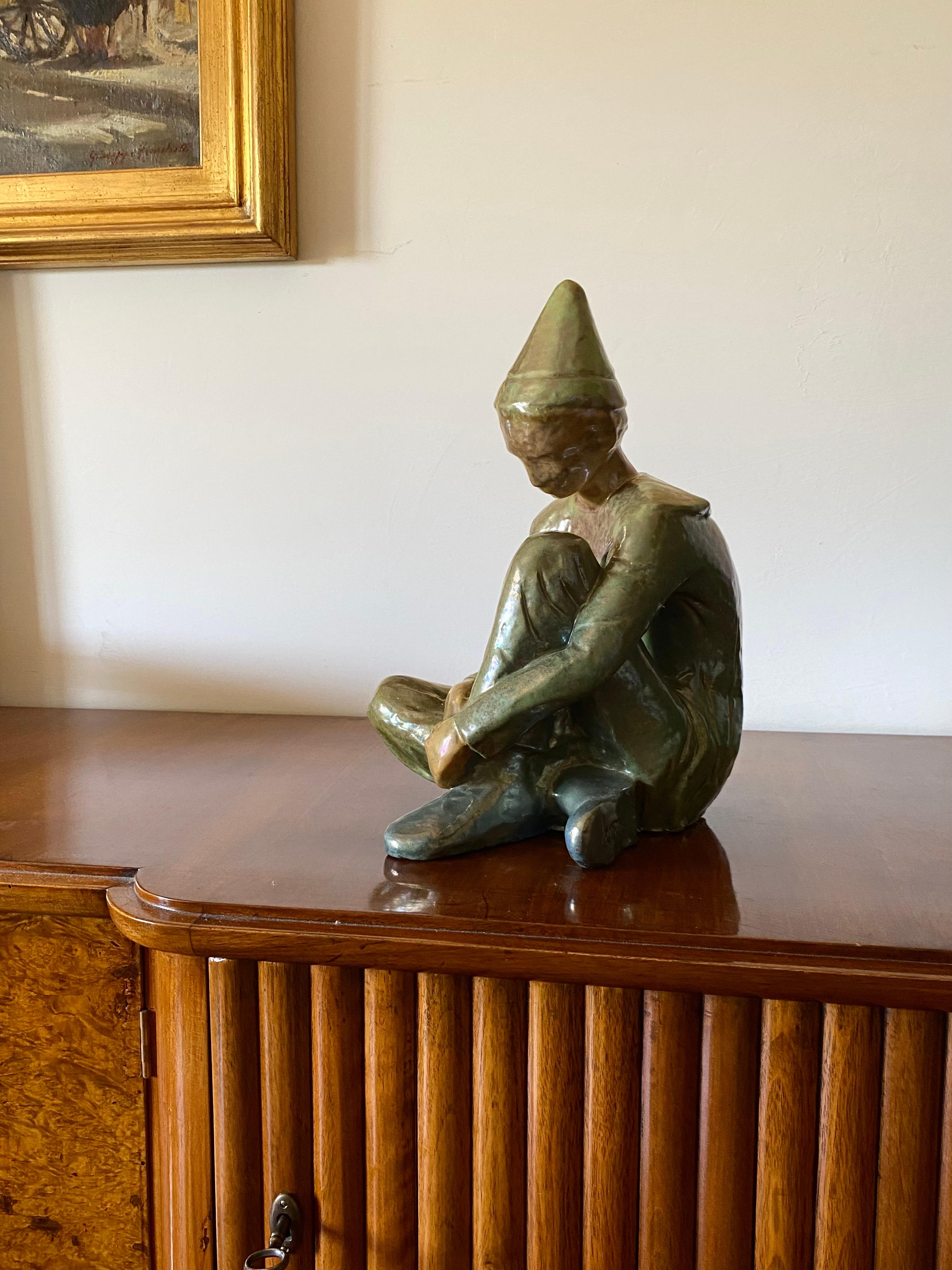 Polished Ceramic green figure of Sitting boy, Giordano Tronconi, Faenza Italy, 1950s For Sale