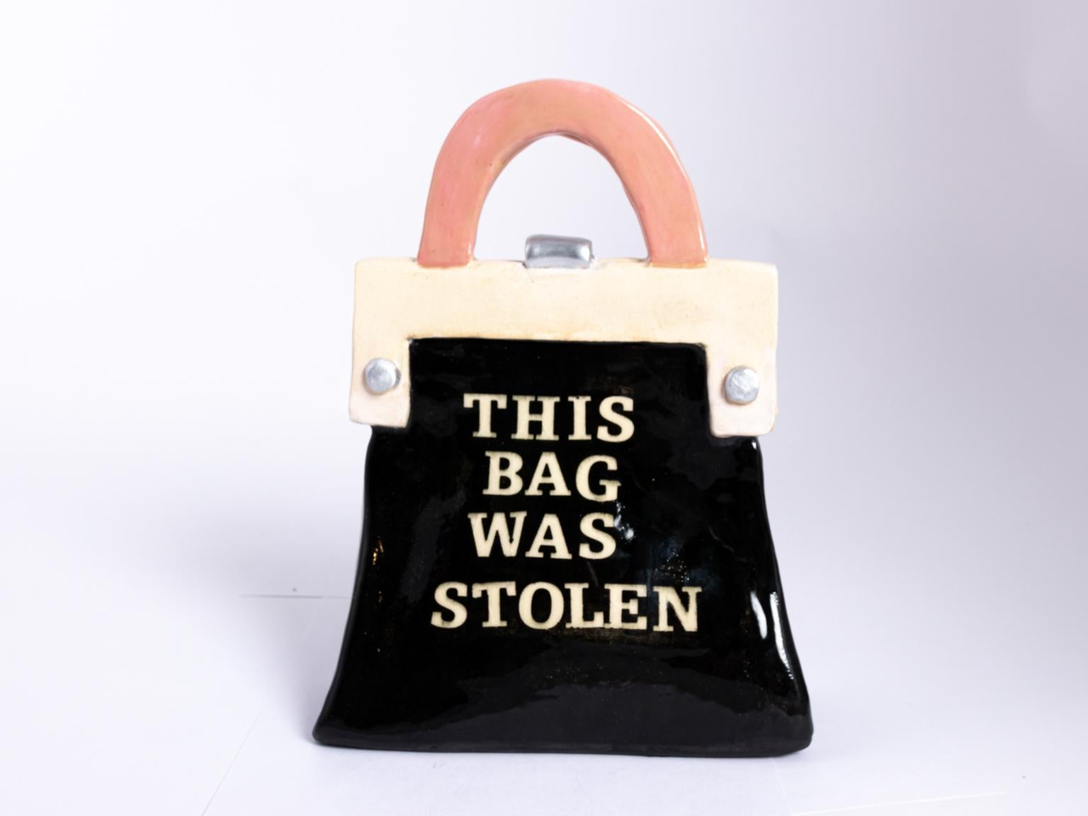 Ceramic, paper, clay hand-built pocketbook sculpture inspired by Perrin, Paris, circa 2019. Made in the United States. The piece features text that reads 