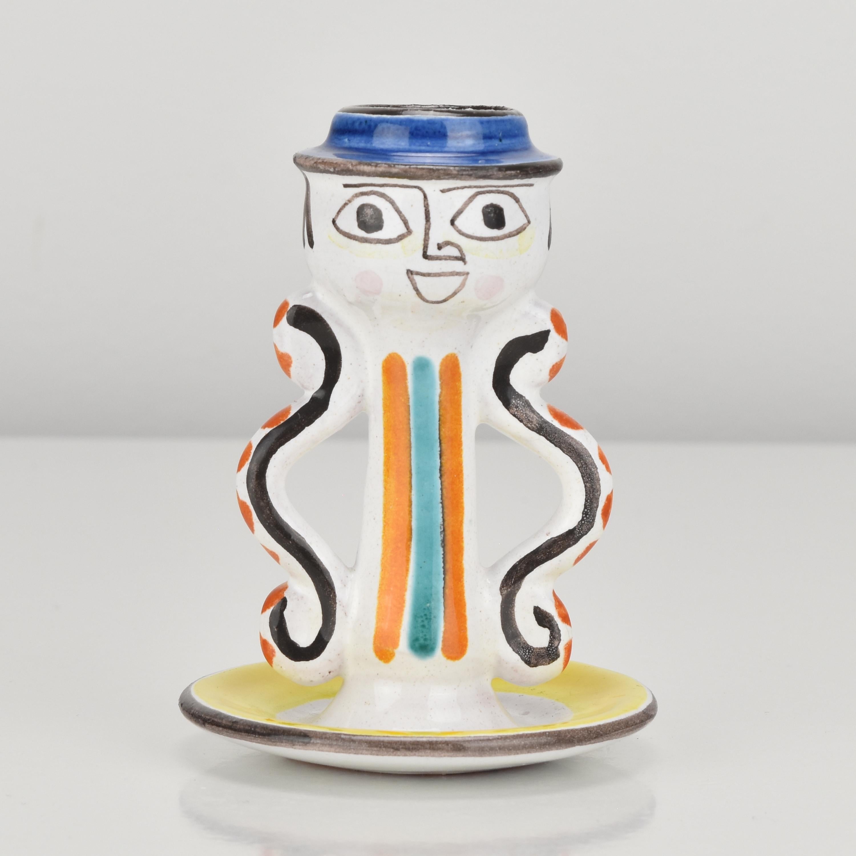 This vintage figural candlestick by Giovanni Desimone Italy is a unique and eye-catching piece of decorative art. DeSimone was a renowned Italian ceramicist and designer who worked in the mid-20th century, known for his whimsical and colorful